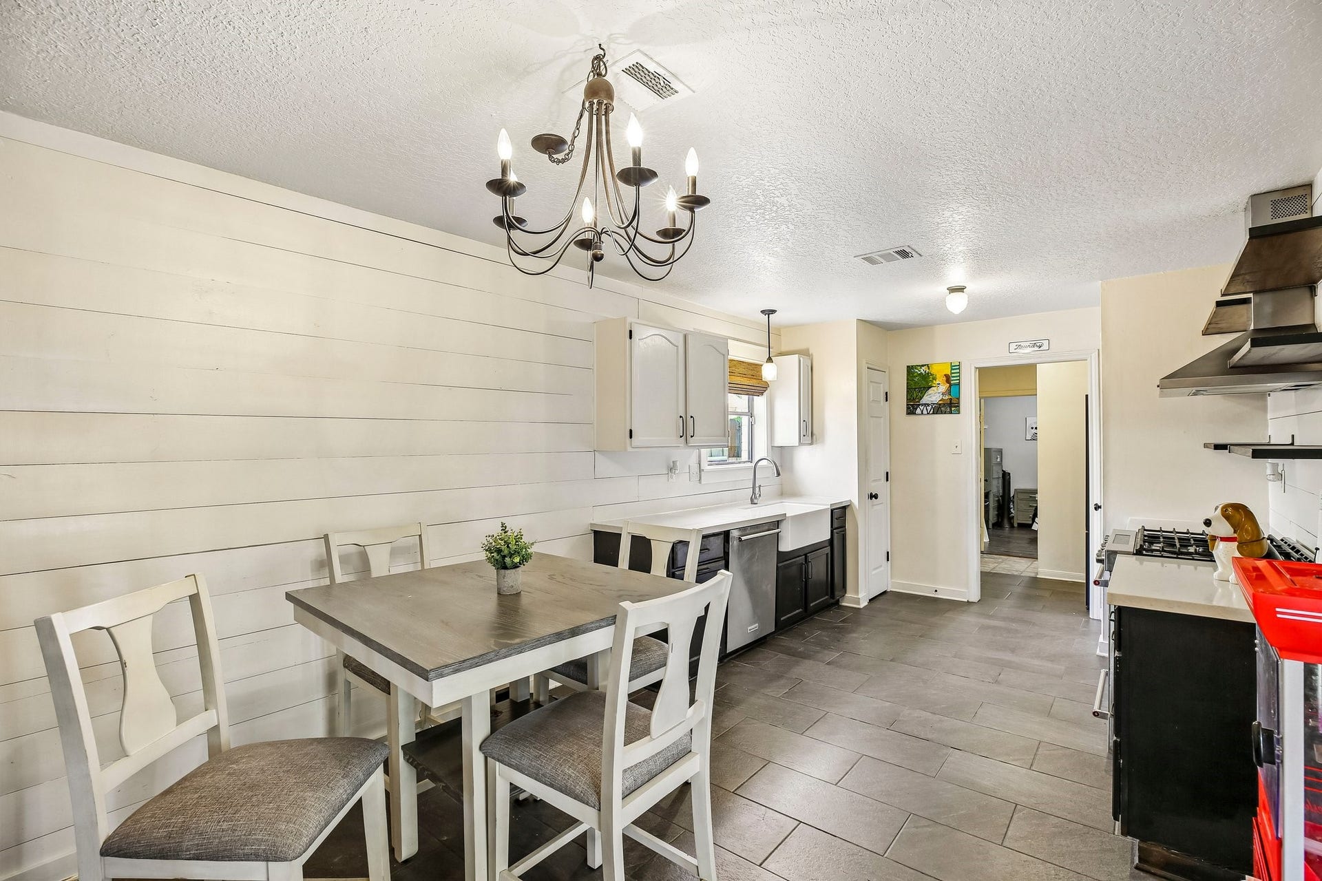 5501 Pecos Street, Dickinson, TX 77539 The kitchen features two pantries and tile flooring.