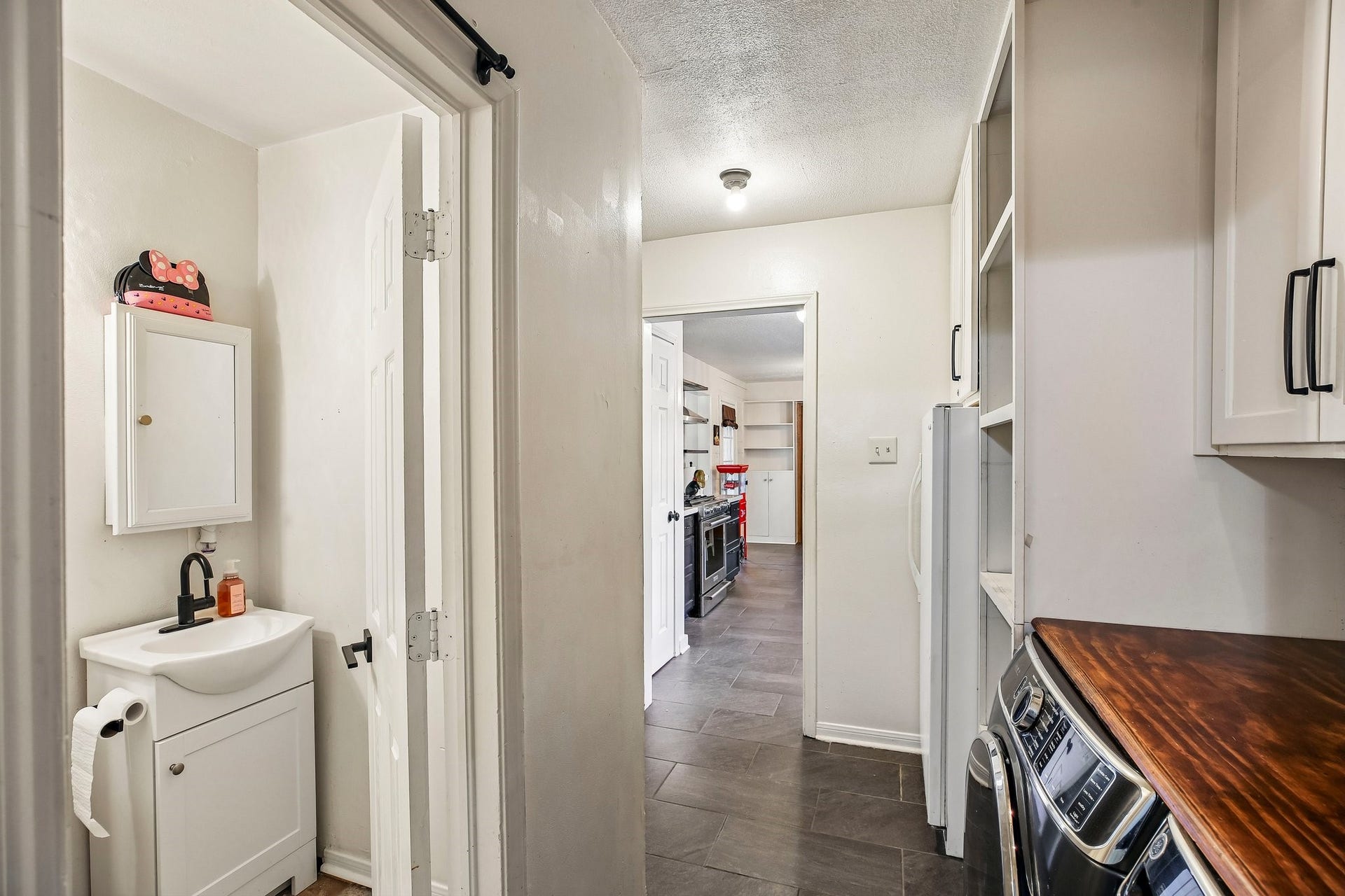 5501 Pecos Street, Dickinson, TX 77539 A convenient half-bath is situated off of the laundry room.