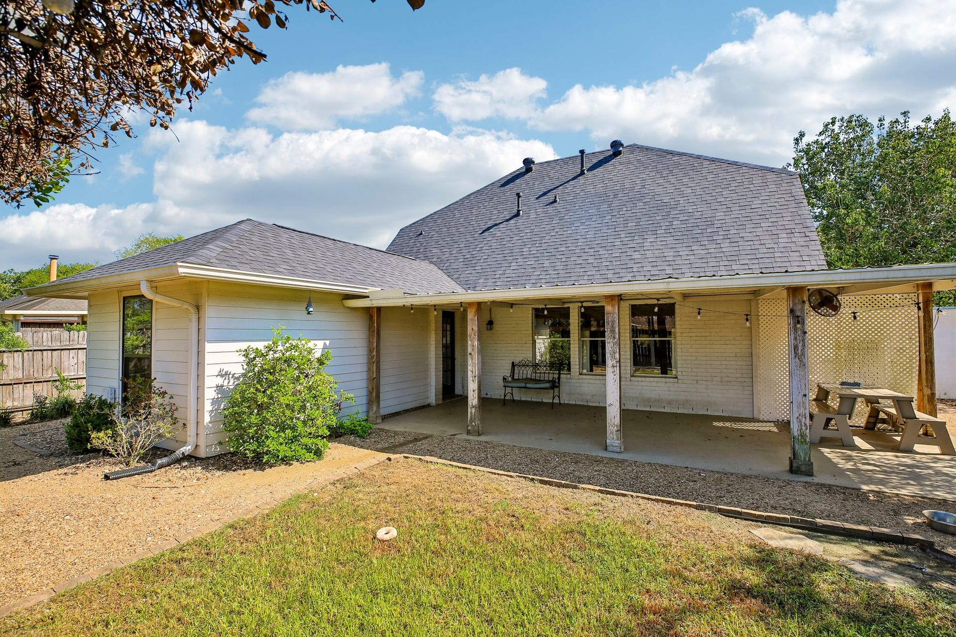 5501 Pecos Street, Dickinson, TX 77539 The spacious backyard is ideal for entertaining with it's large covered porch, additional pergola and lawn space.