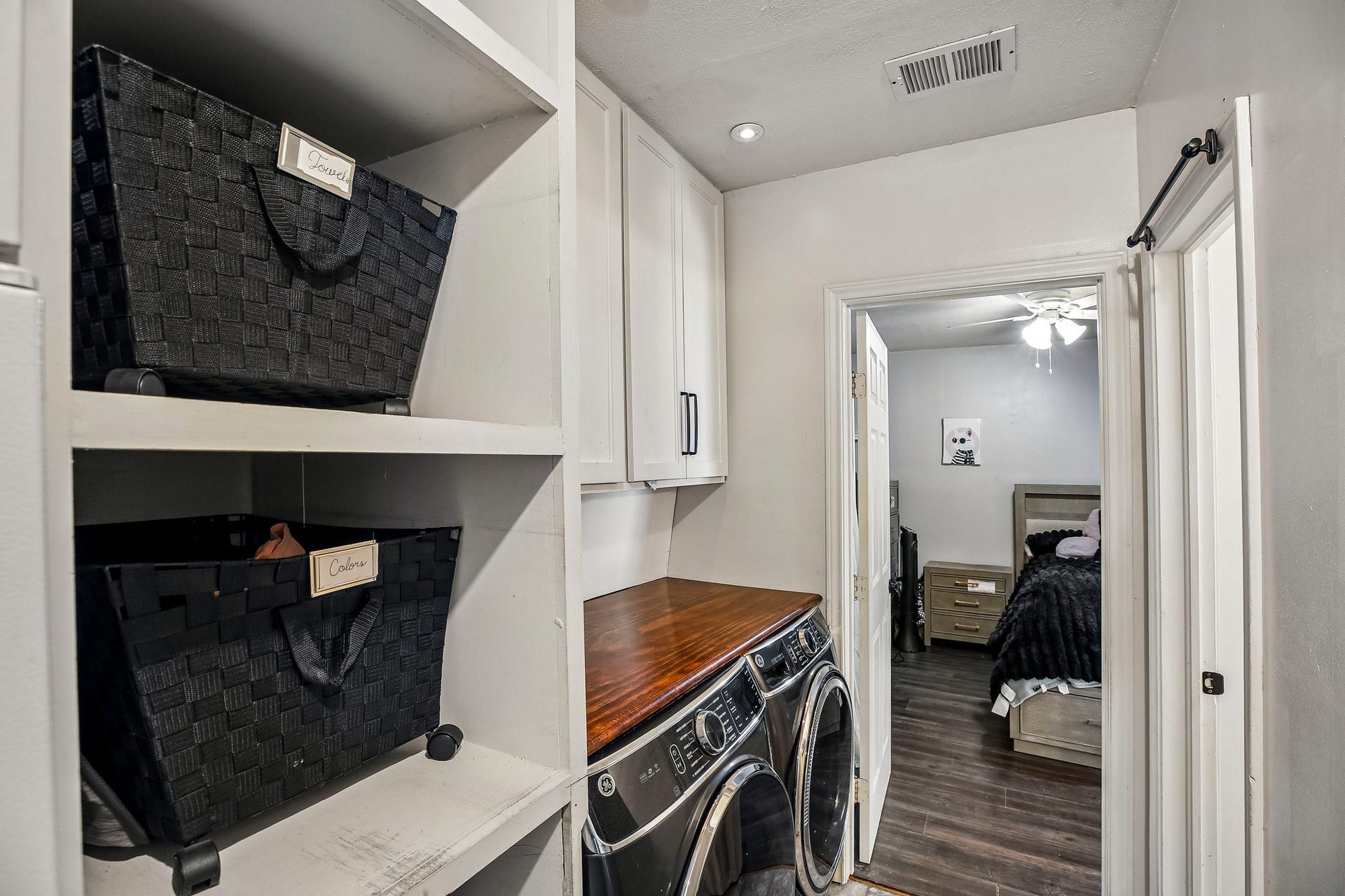 5501 Pecos Street, Dickinson, TX 77539 Laundry room with plenty of storage.