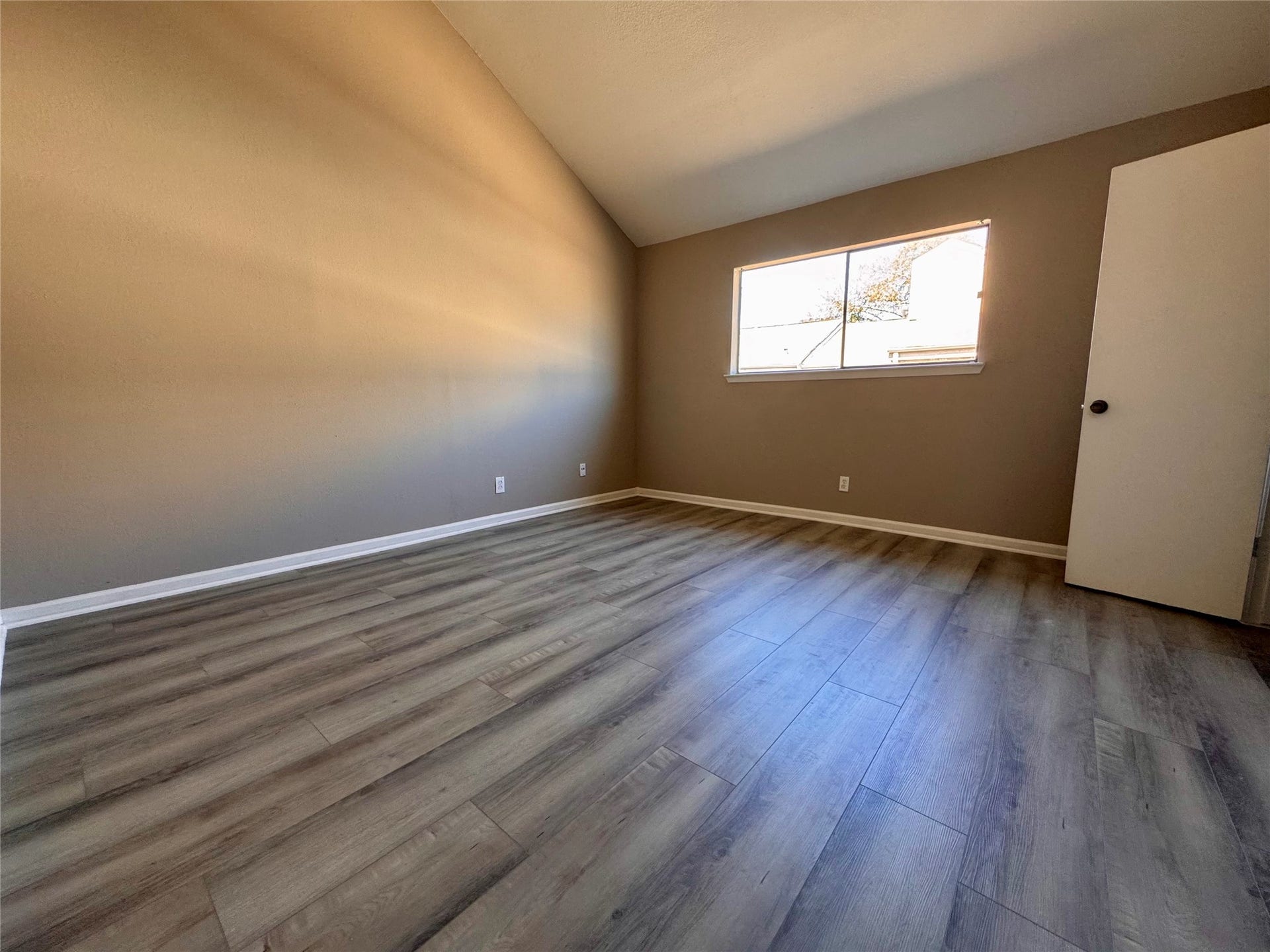 10811 Richmond Avenue, #54, Houston, TX 77042 downstairs bedroom with tall ceiling and abundant of natural lights
