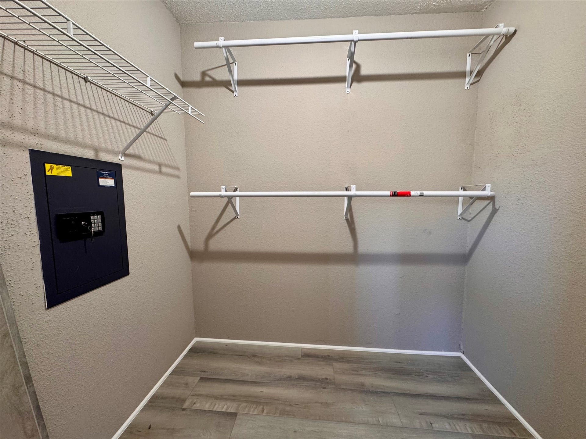 10811 Richmond Avenue, #54, Houston, TX 77042 large walk in closet in downstair bedroom with a built in safe box