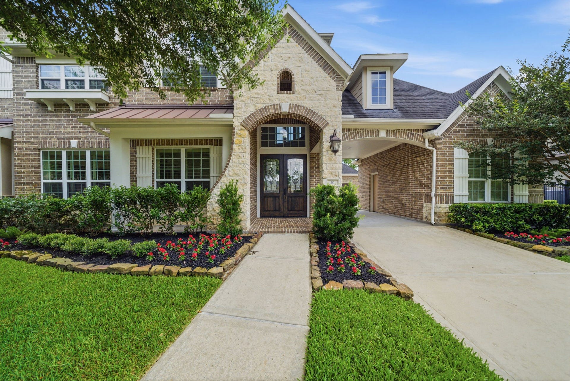 30 Little Rise Drive, Missouri City, TX 77459 Beautiful curb appeal highlighted by a timeless brick and stone exterior.