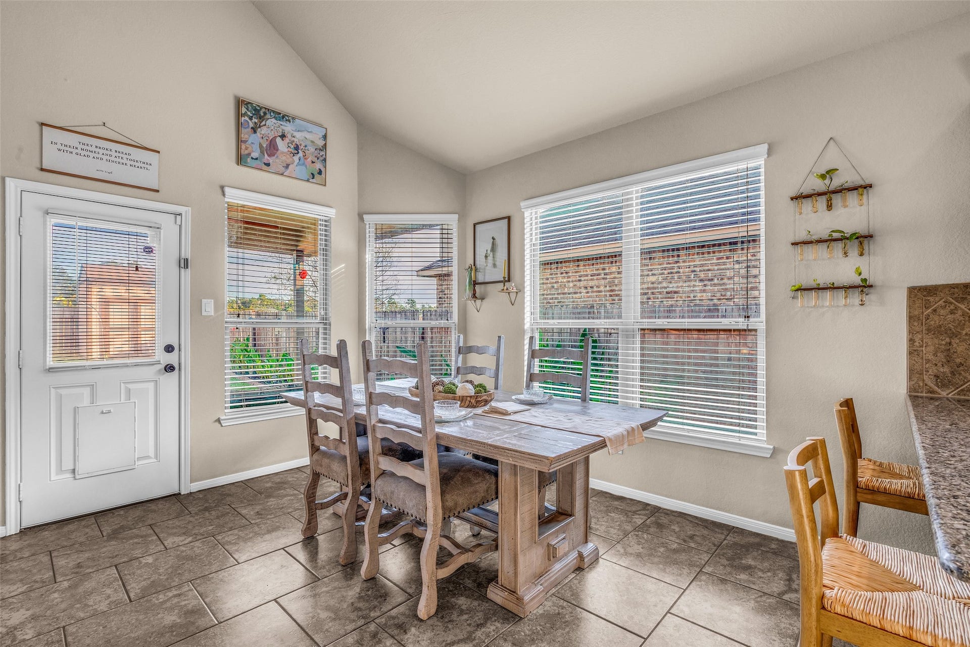 Light streams in through the full sized double paned windows dressed in blinds. Backyard access even has a door for your fur baby.