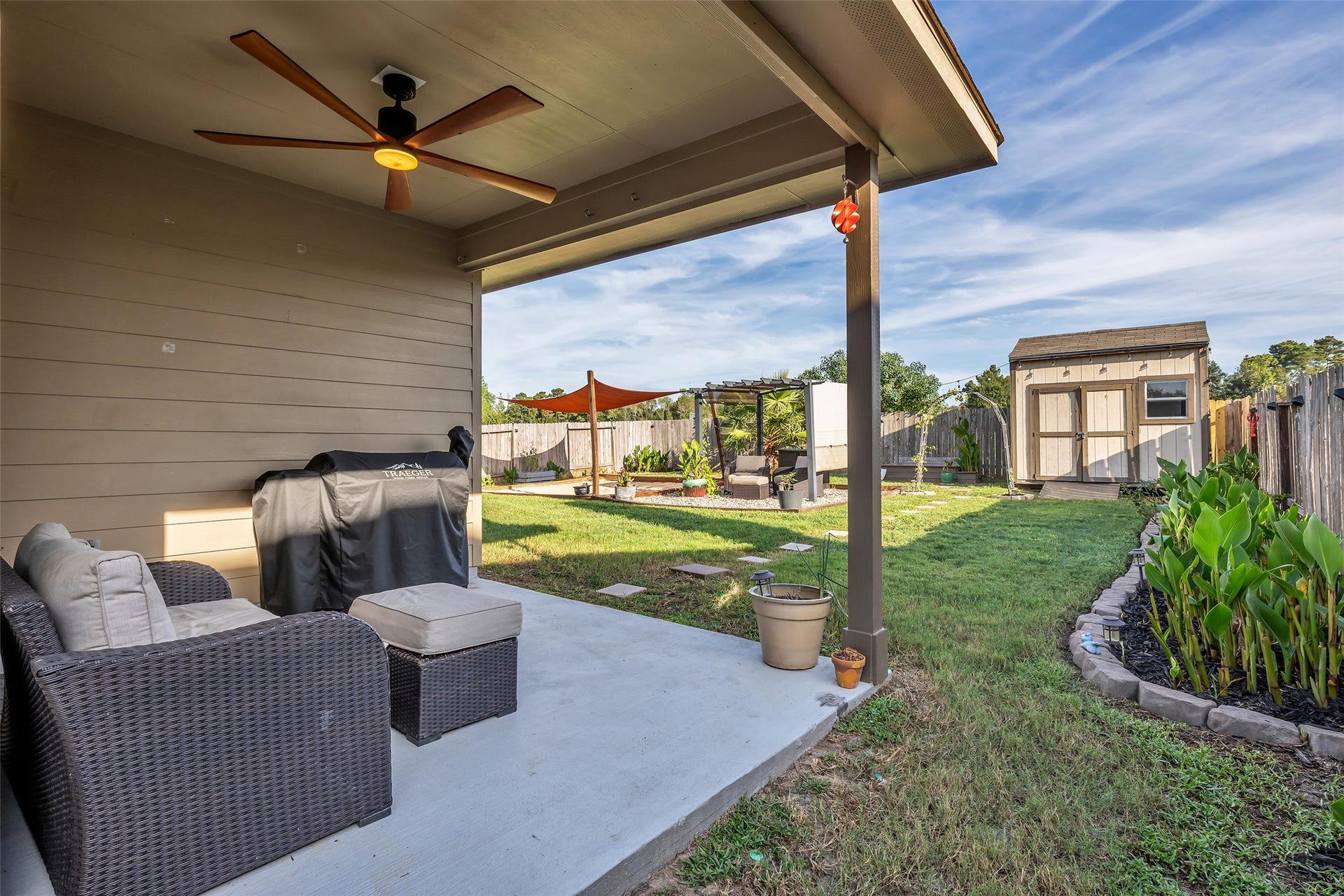Just in time for our cooler weather - this backyard offers options for outdoor entertainment. The covered patio is an ideal space for morning coffee while admiring the new blooms in the flowerbeds. The cute shed conveys with the house.