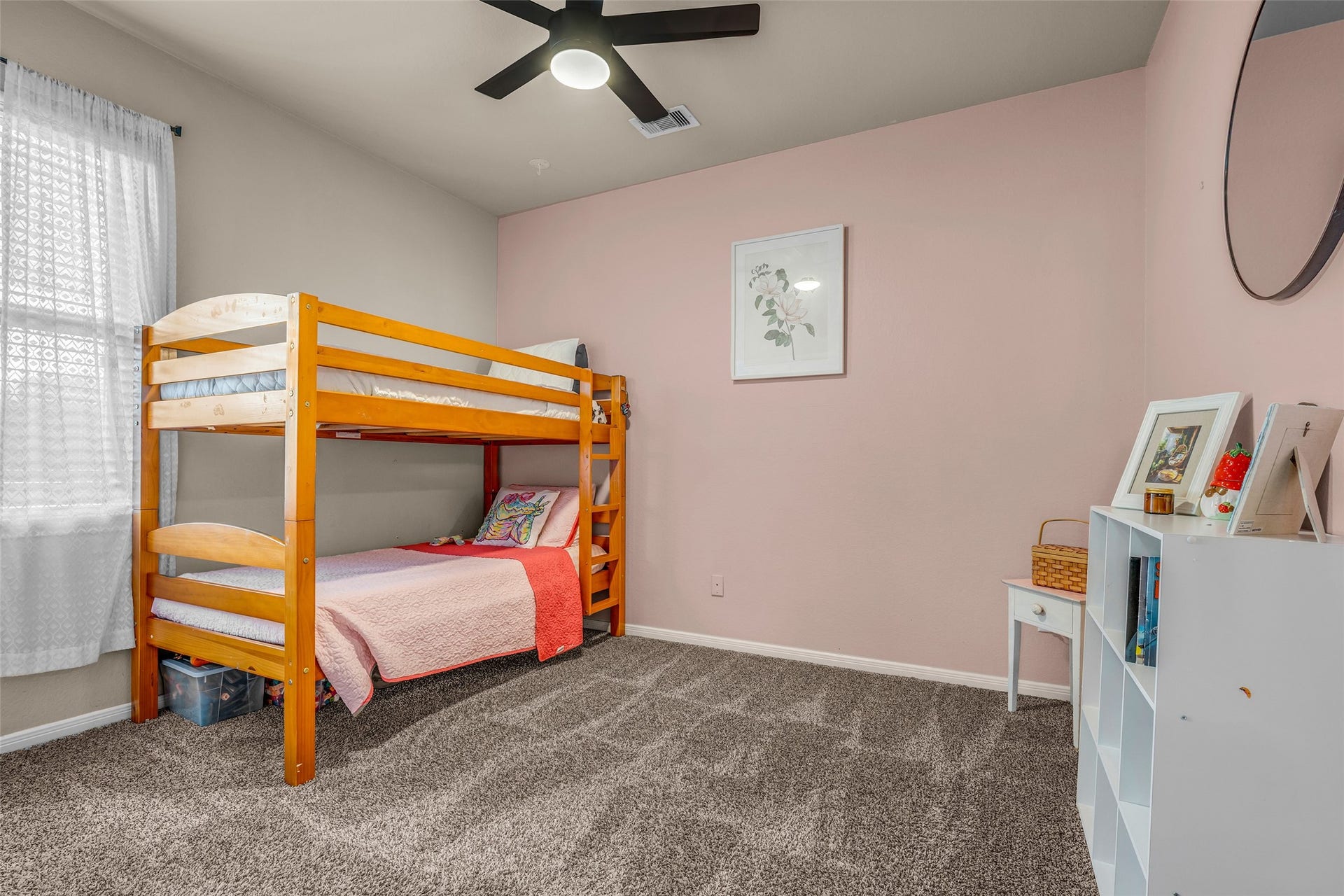Bedroom #2 enjoys a newly installed ceiling fan and plush carpet for your toes.