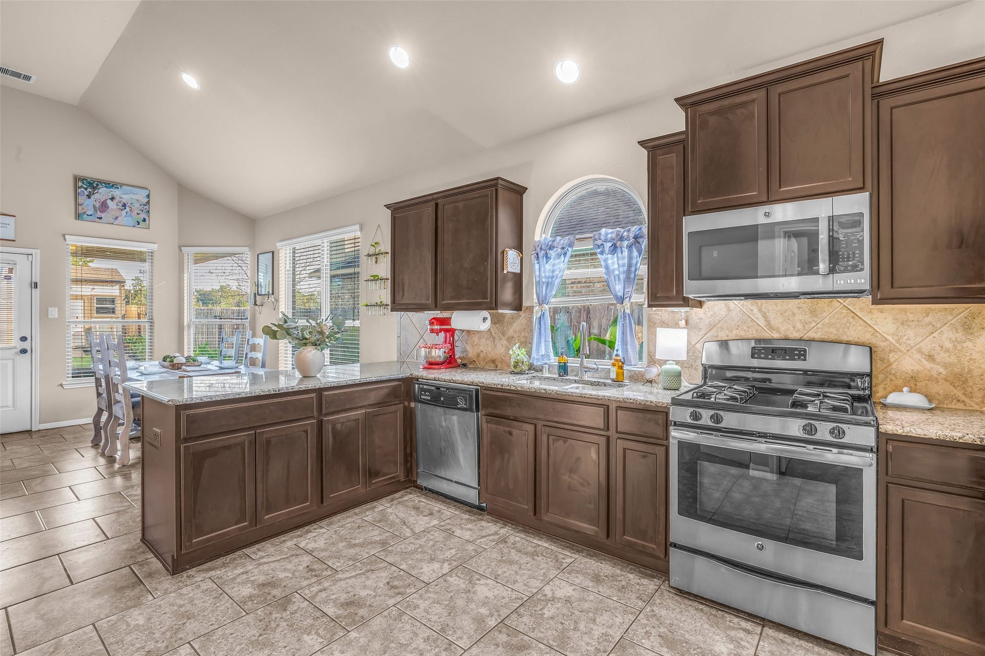 Abundant granite counter space provides plenty of room for baking, meal prep, and entertaining.