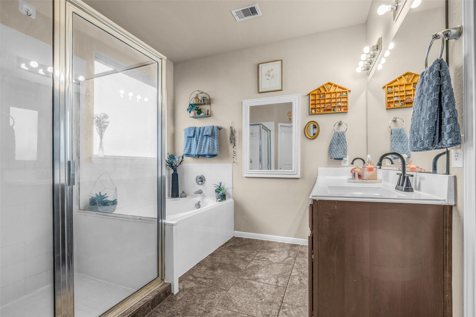 This Primary Bath has it all - a double bowl vanity, soaking tub, and extended shower. Grab your favorite read, some bubbles and a bevy and you're off to relaxationland! Prefer the shorter shower route? You have choices.