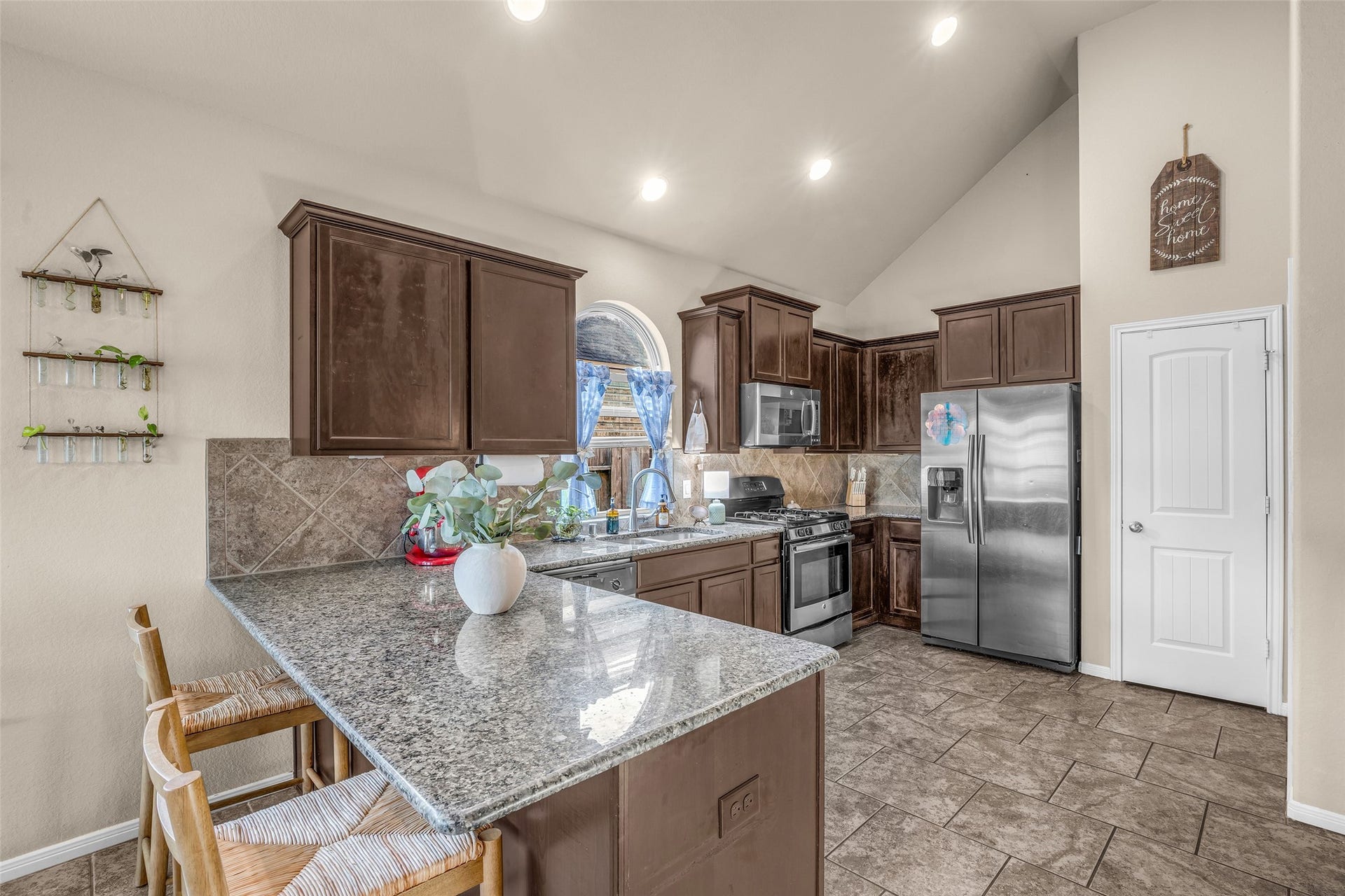 There's no shortage of cabinet space to stock your kitchen with all the best gadgets and equipment. The pantry is straight ahead with the laundry tucked to the right. It has additional storage space for your big box store runs.