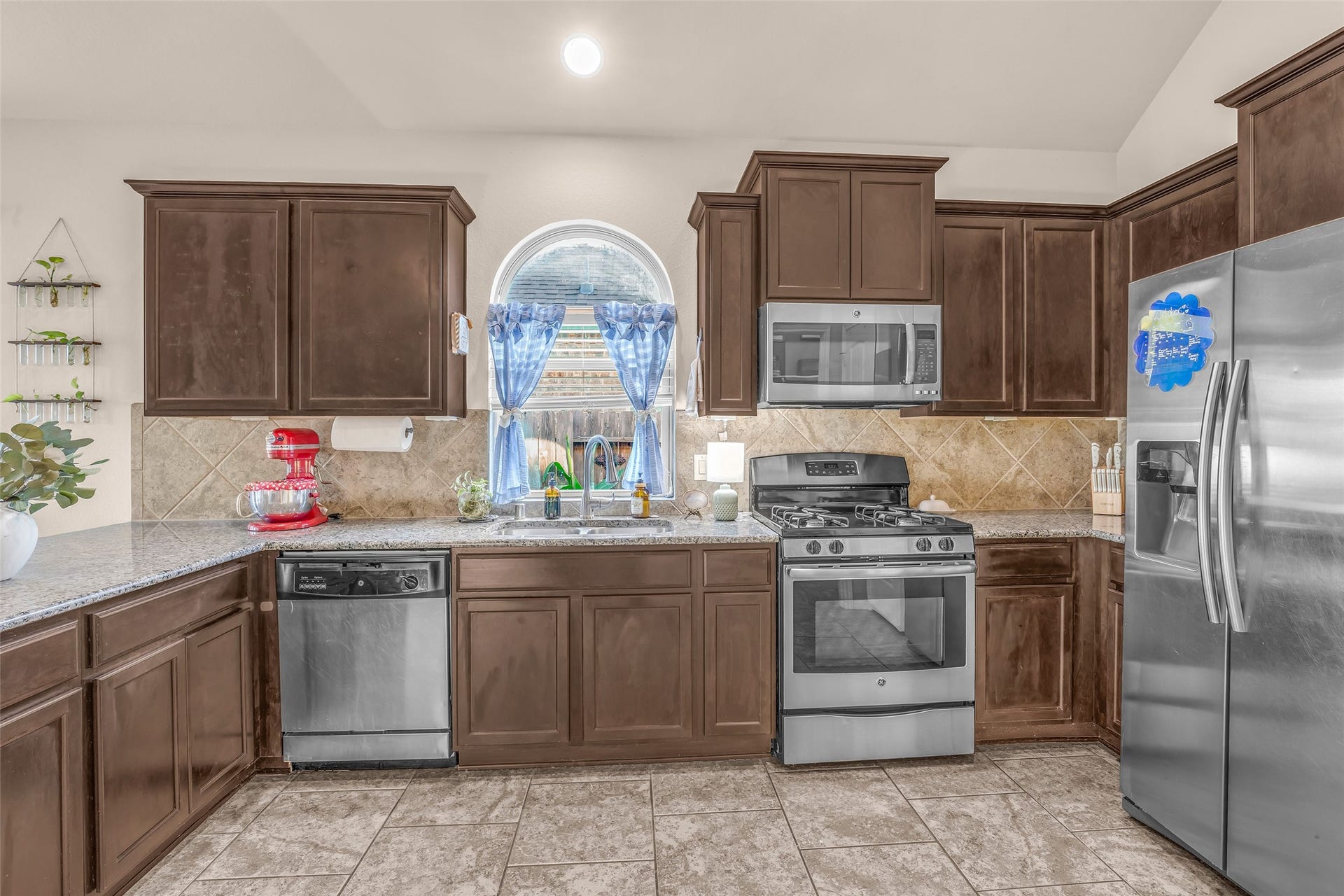 Stainless steel applicances create an ideal culinary backdrop for your creative cooking.