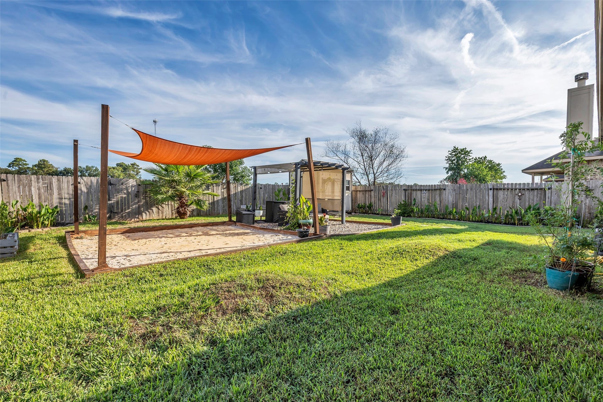 Your private beach oasis awaits! Wouldn't a cowboy pool be a great way to go under the brick-hued cover? Adjacent is a seating area with pergola that stays with the house as well.