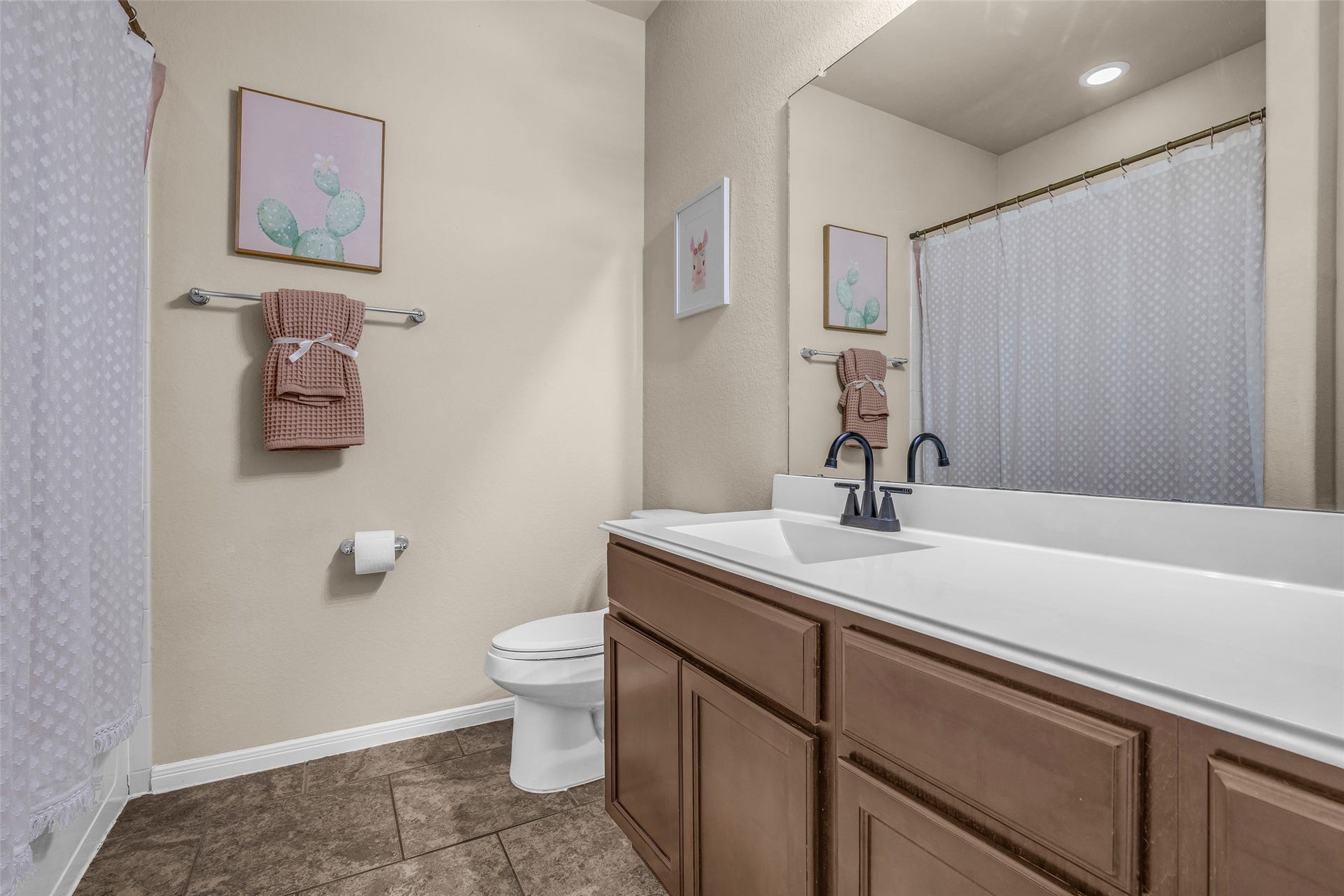 The extened vanity provides plenty of storage space on top and below. A shower/tub combination fits the bill whether you're on Team Bath or Team Shower.