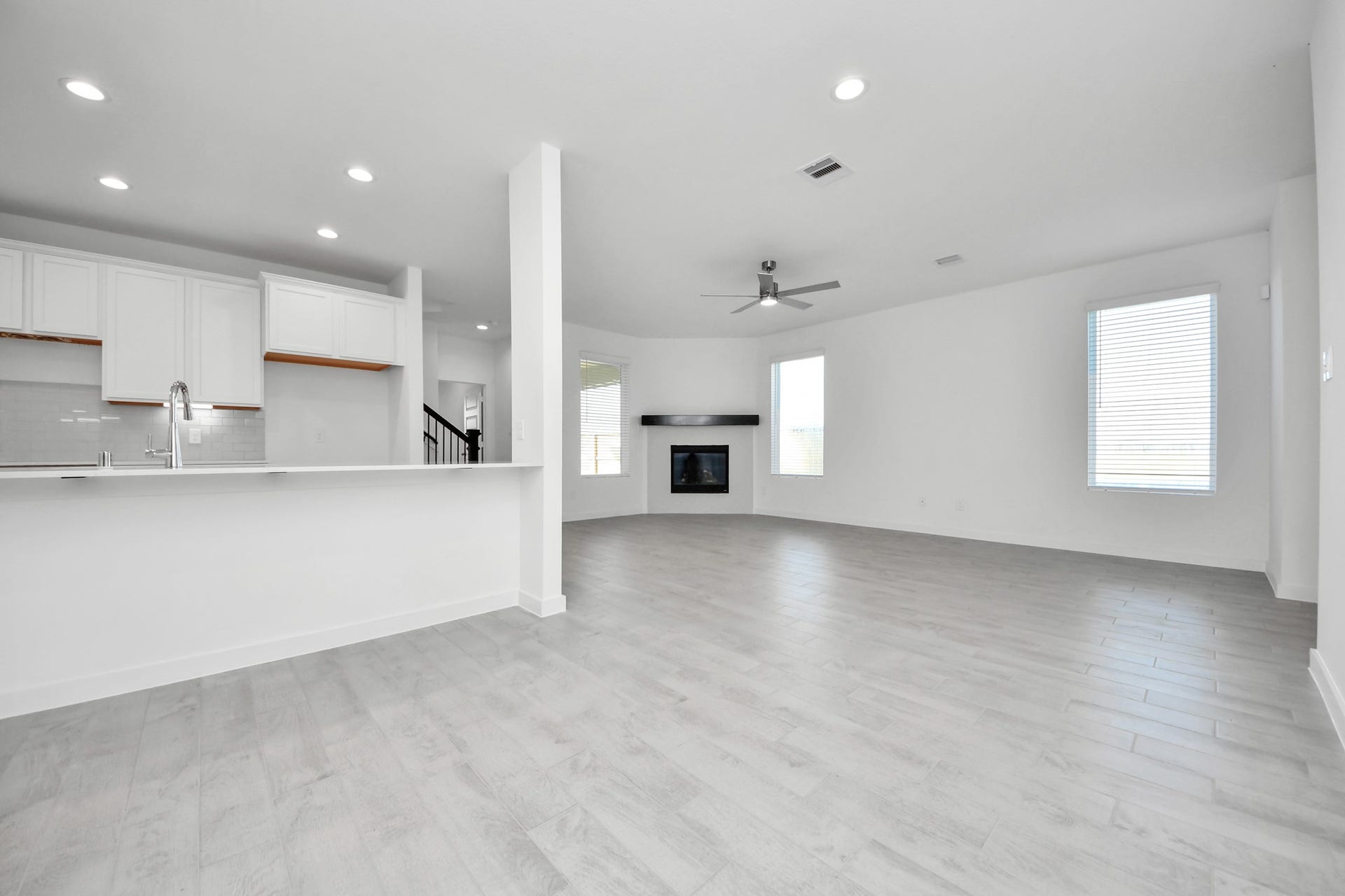 Make memories gathered around the table with your family and friends! This spacious dining room features elegant flooring, custom paint, and adjacent to family room and kitchen for open concept feel. Sample photo of completed home with similar floor plan. Actual colors and selections may vary.