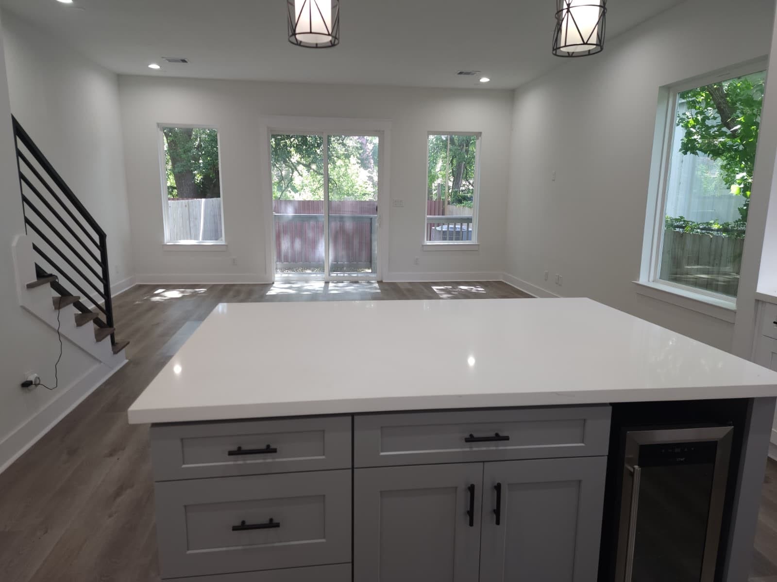 5518E CORTLANDT Street, Houston, TX 77076 Ample storage in the sleek kitchen island enhances functionality and style.