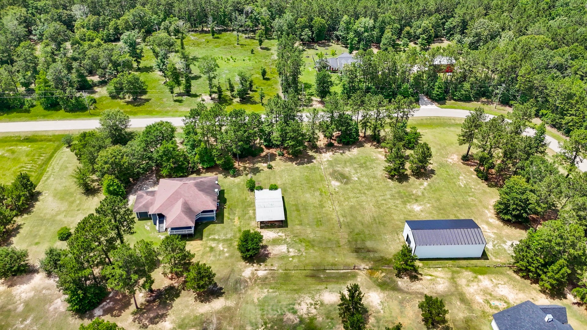 Welcome to 4324 Holstein 2.91 acres corner property, 3 bedroom 2 bath home with a lake view, barn and 30x60 metal shop with a garage apartment ready to be built out.