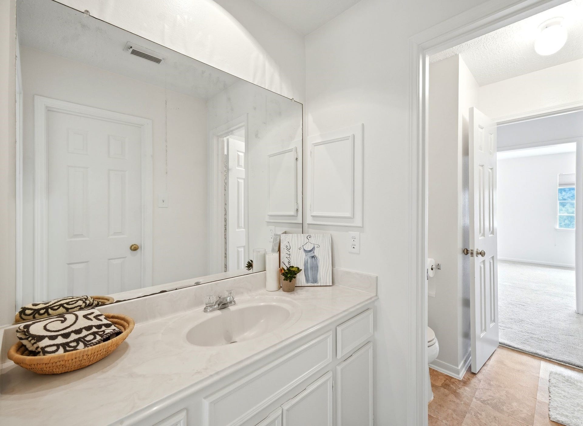 2216 Fairwater Park Drive, League City, TX 77573 Elegant vanity area with ample counter space and a large mirror, perfectly positioned to enhance your morning routine.