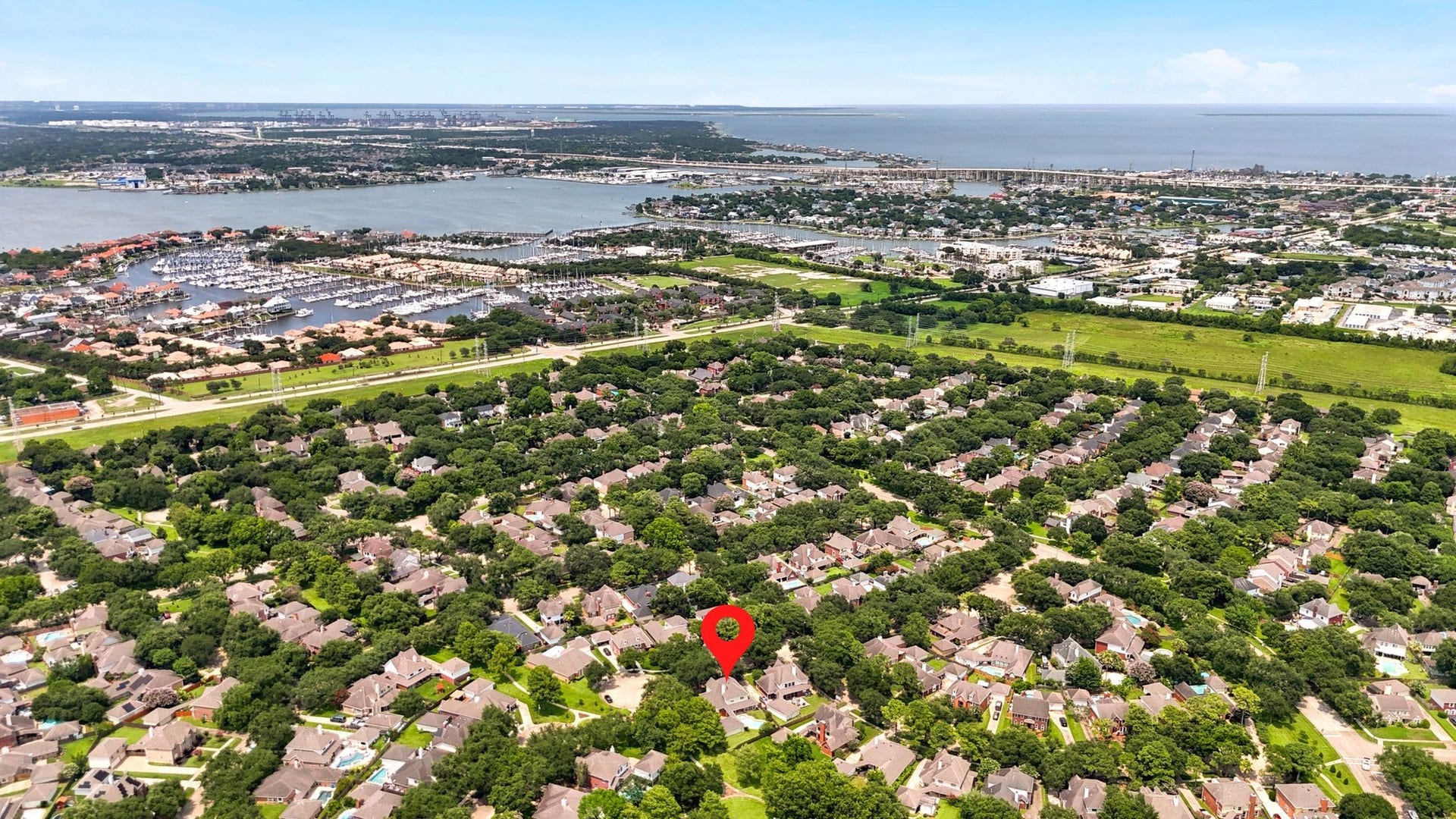 2216 Fairwater Park Drive, League City, TX 77573 Nestled near the serene Clear Lake, this property offers an ideal blend of natural beauty and convenient access to urban amenities.