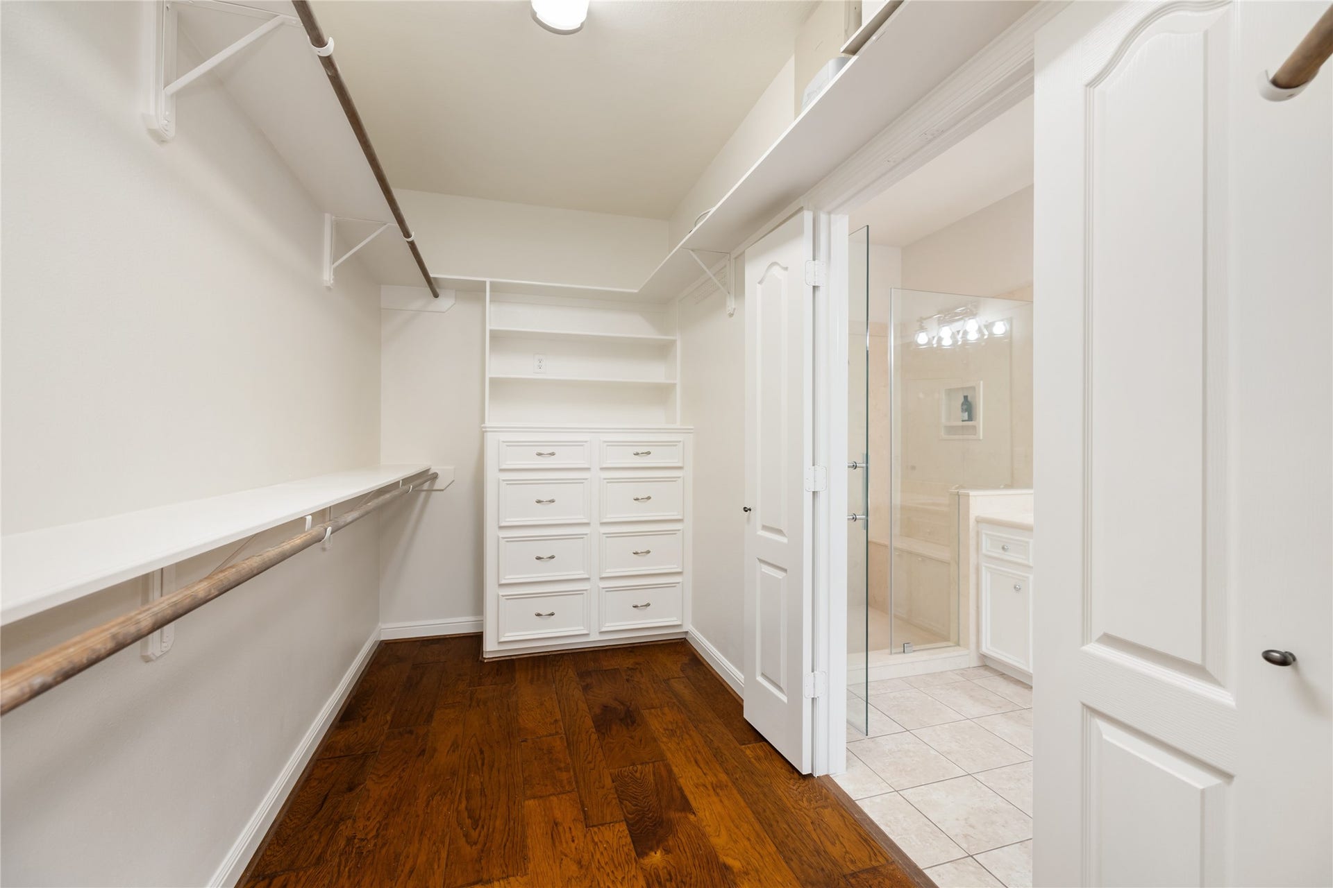Primary walk-in closet with built-ins