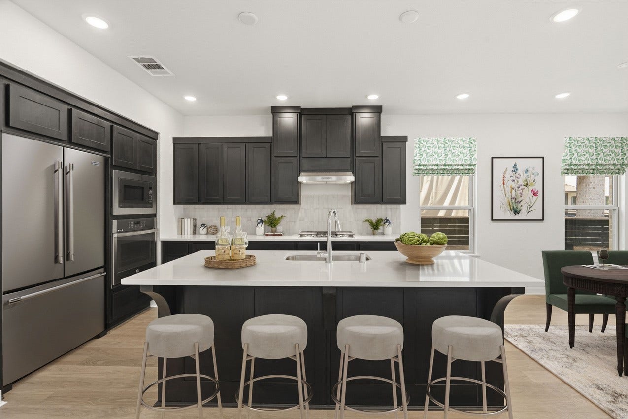 3431 Loam Lane, Richmond, TX 77406 The stunning kitchen showcases beautiful cabinetry and a generous island, creating a stylish and welcoming space for gathering with family and friends.