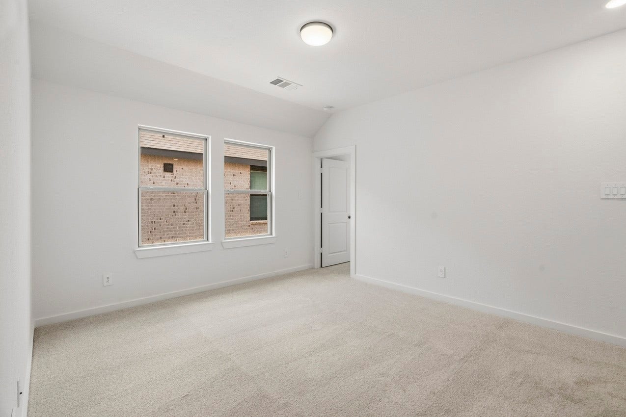 3431 Loam Lane, Richmond, TX 77406 The bright loft features expansive windows that fill the space with natural light and create an airy, welcoming atmosphere.