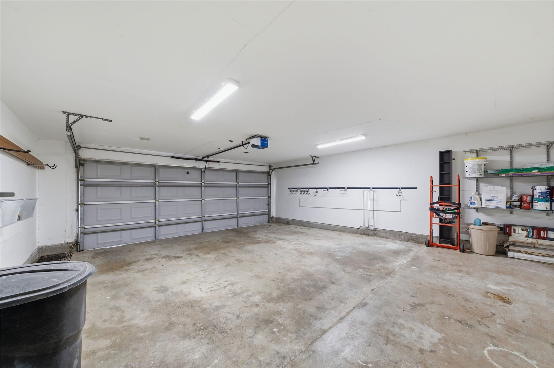 703 Queensmill Court, Houston, TX 77079 Two-car garage allows for easy parking and storage.