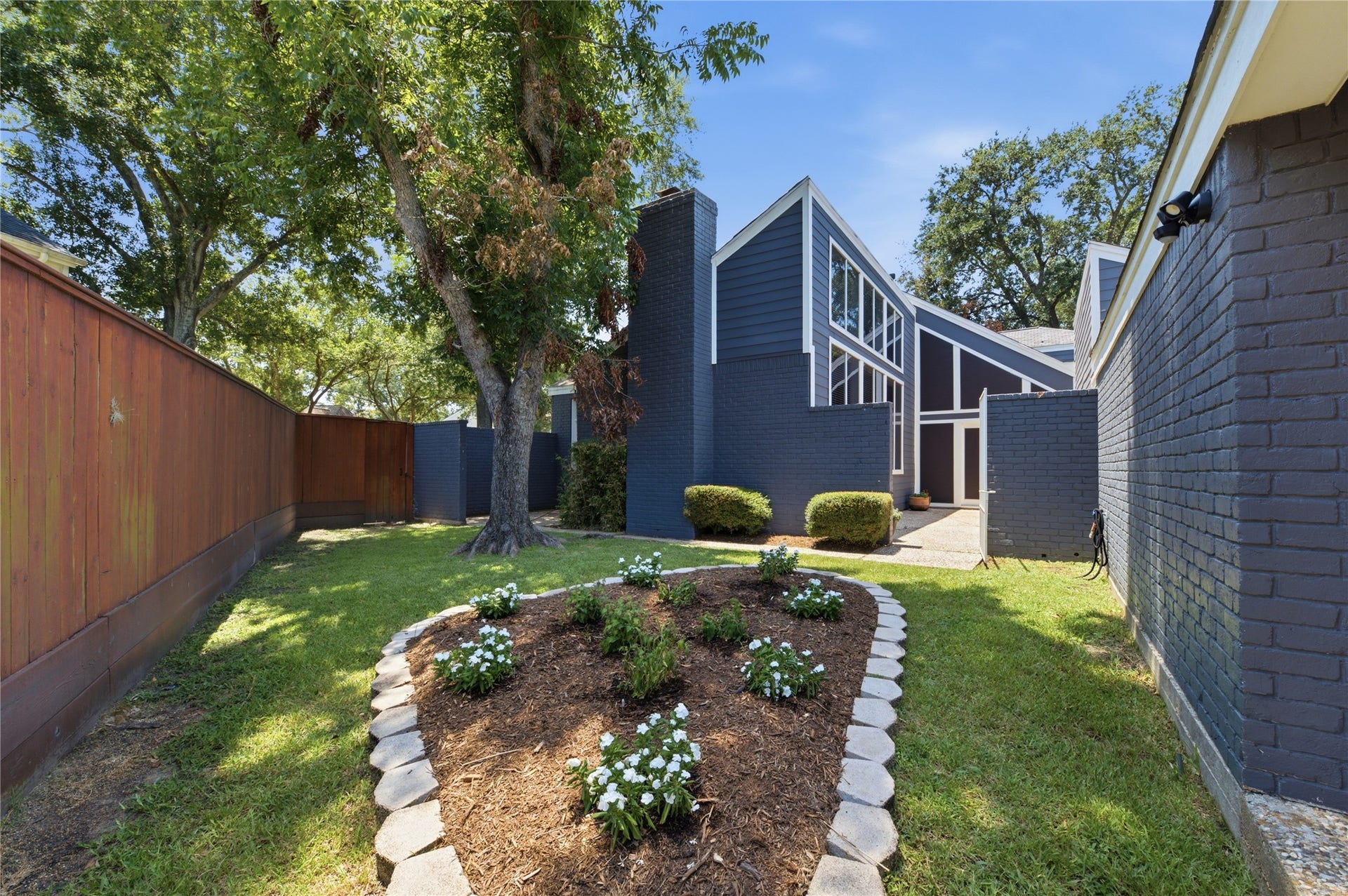 703 Queensmill Court, Houston, TX 77079 This backyard has it all! Patio, pool and a green space perfect for play or gardening!