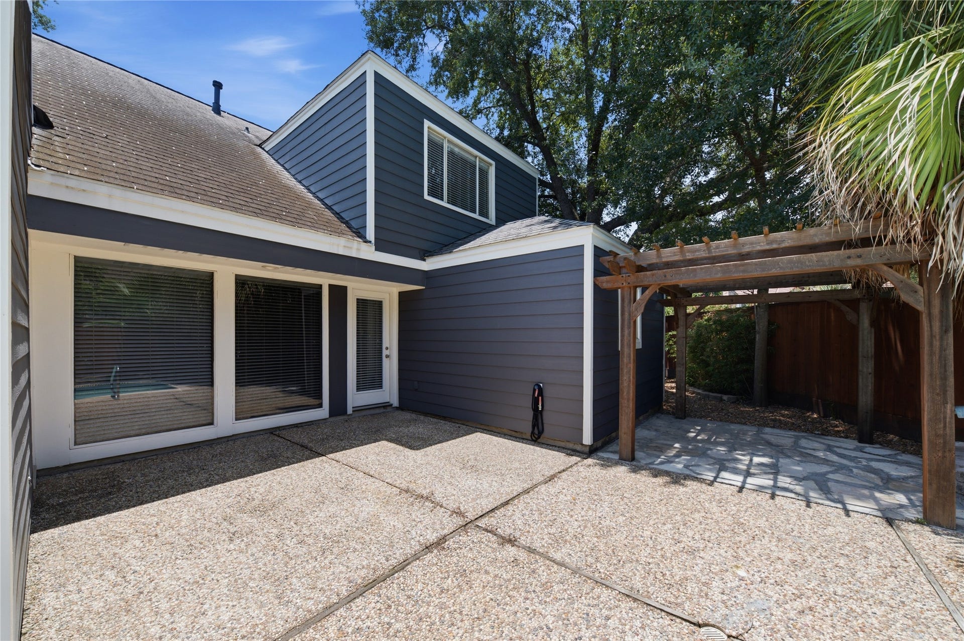 703 Queensmill Court, Houston, TX 77079 Private backyard sanctuary perfect for outdoor living.
