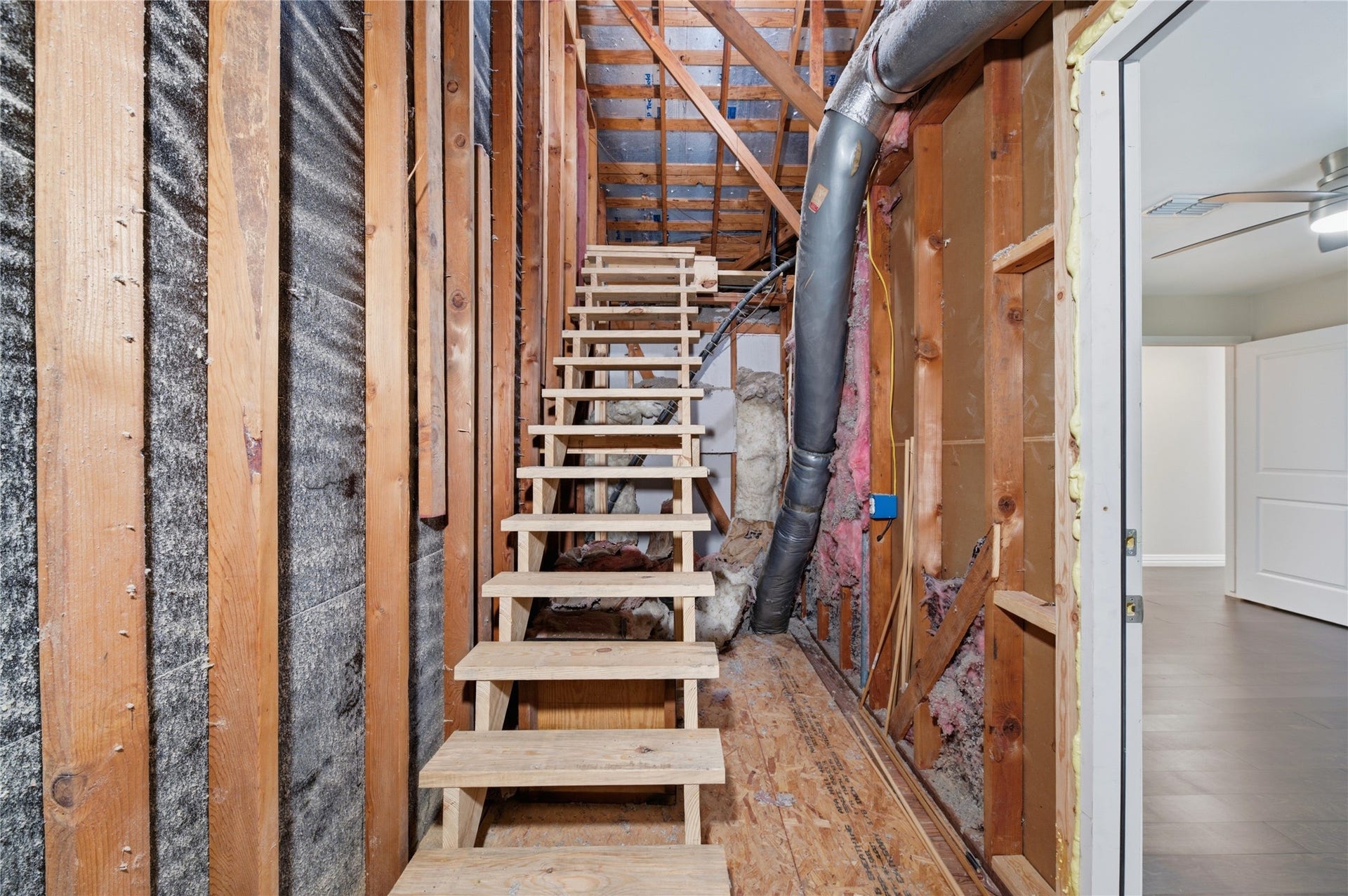 703 Queensmill Court, Houston, TX 77079 Staircase attic access.