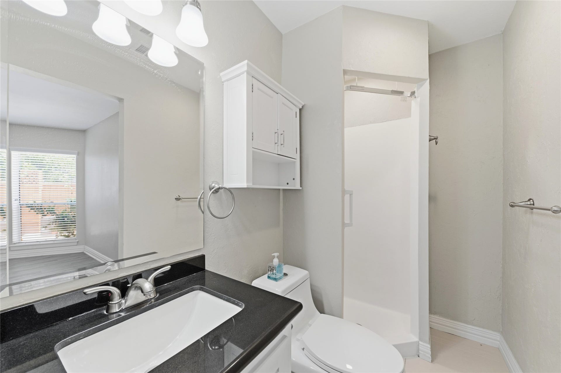 703 Queensmill Court, Houston, TX 77079 Secondary full bathroom featuring a walk-in shower.