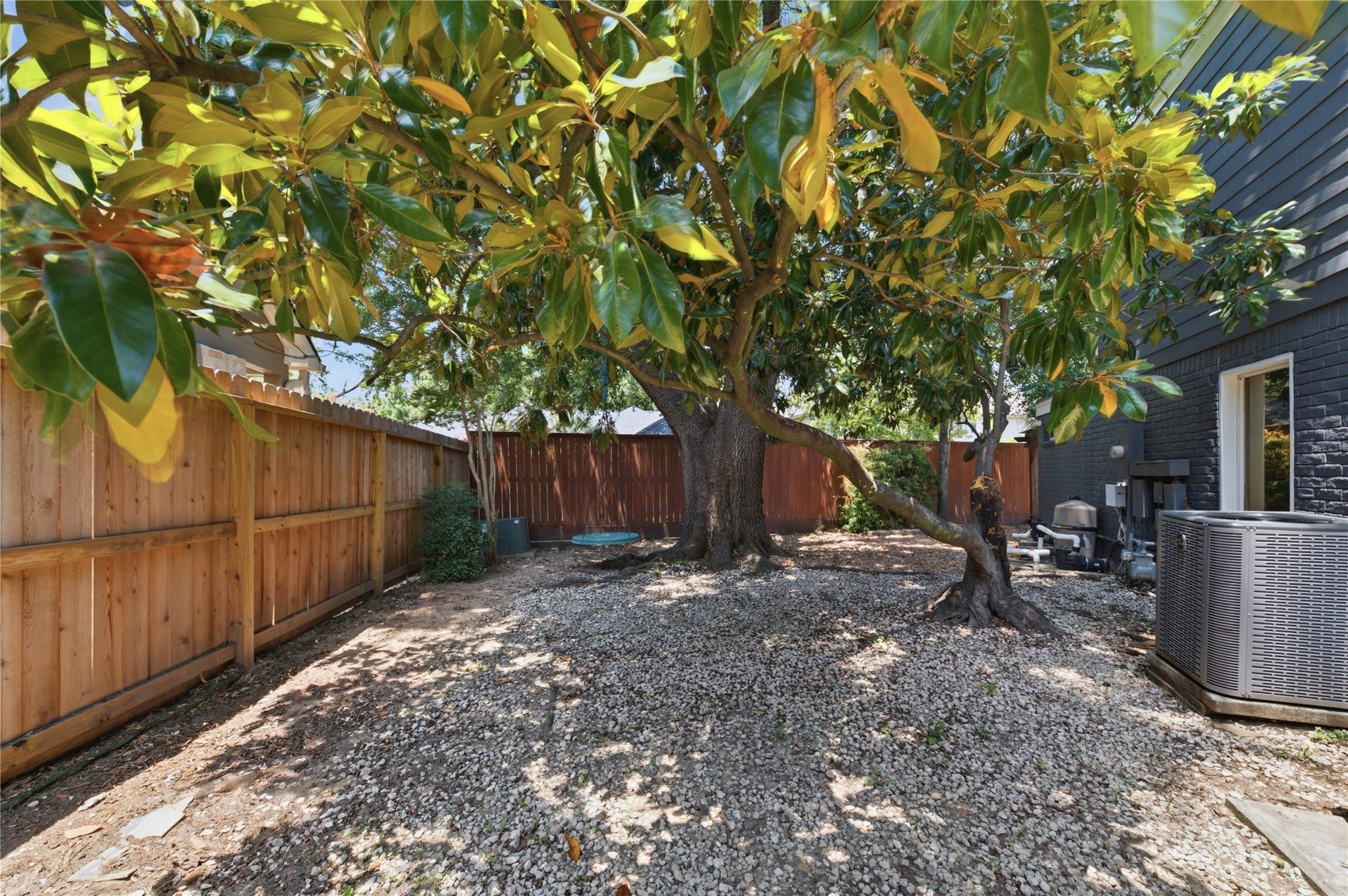 703 Queensmill Court, Houston, TX 77079 Fully fenced yard offers privacy and tranquility.