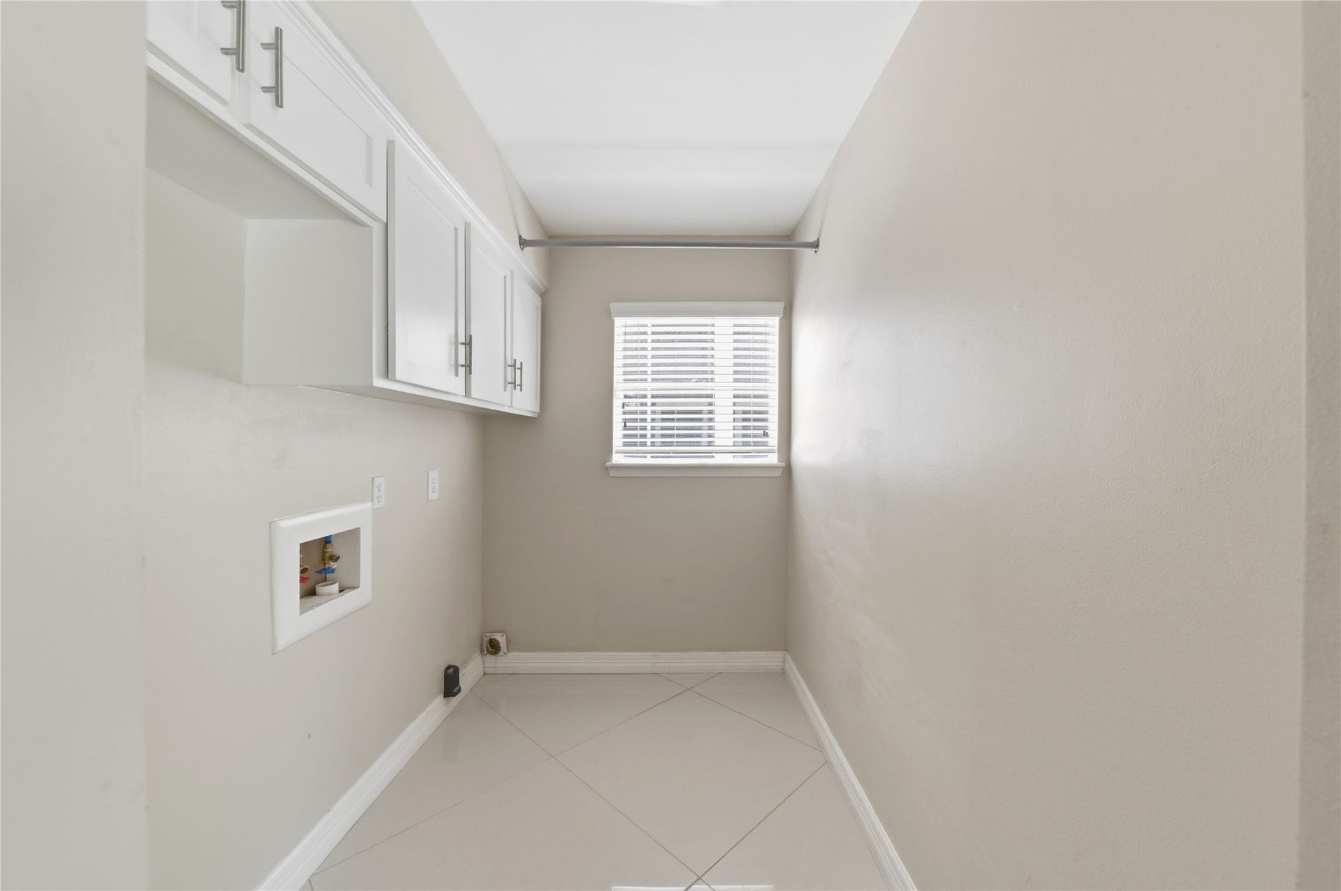 703 Queensmill Court, Houston, TX 77079 Laundry room with built-in storage!