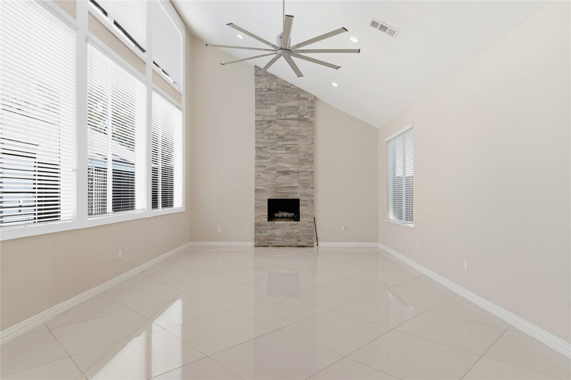 703 Queensmill Court, Houston, TX 77079 Floor-to-ceiling fireplace serves as a breathtaking focal point.