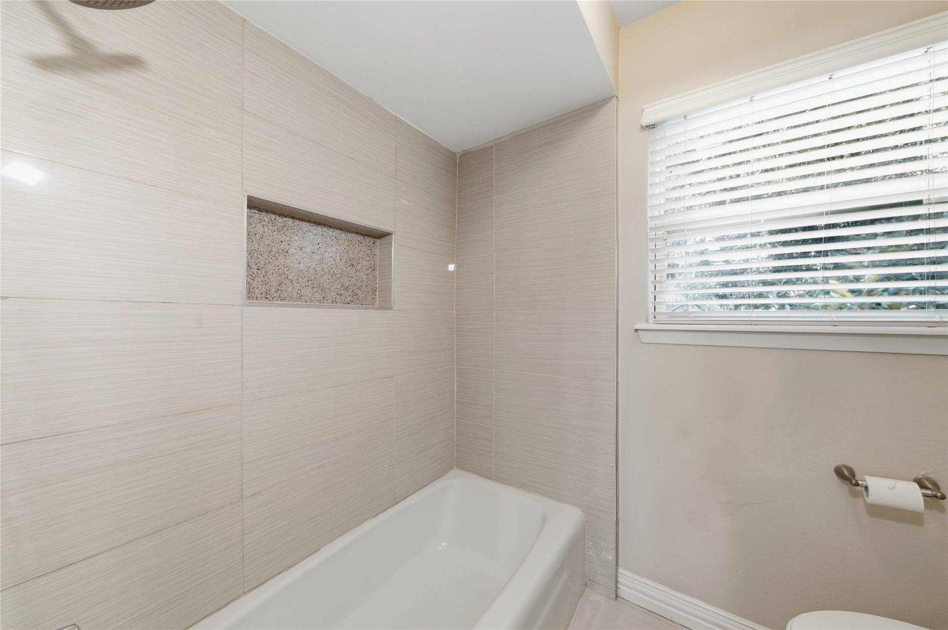 703 Queensmill Court, Houston, TX 77079 Thoughtfully updated guest bathroom with modern fixtures.