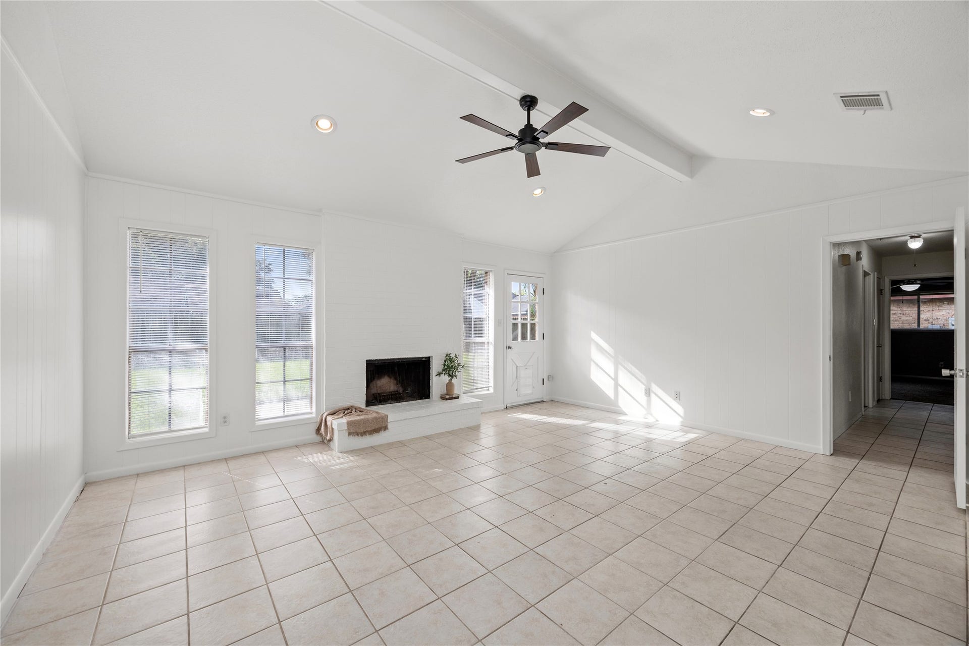 3926 Marilyn Street, Rosenberg, TX 77471 Light and bright family room with vaulted ceiling, wood burning fireplace and fresh paint