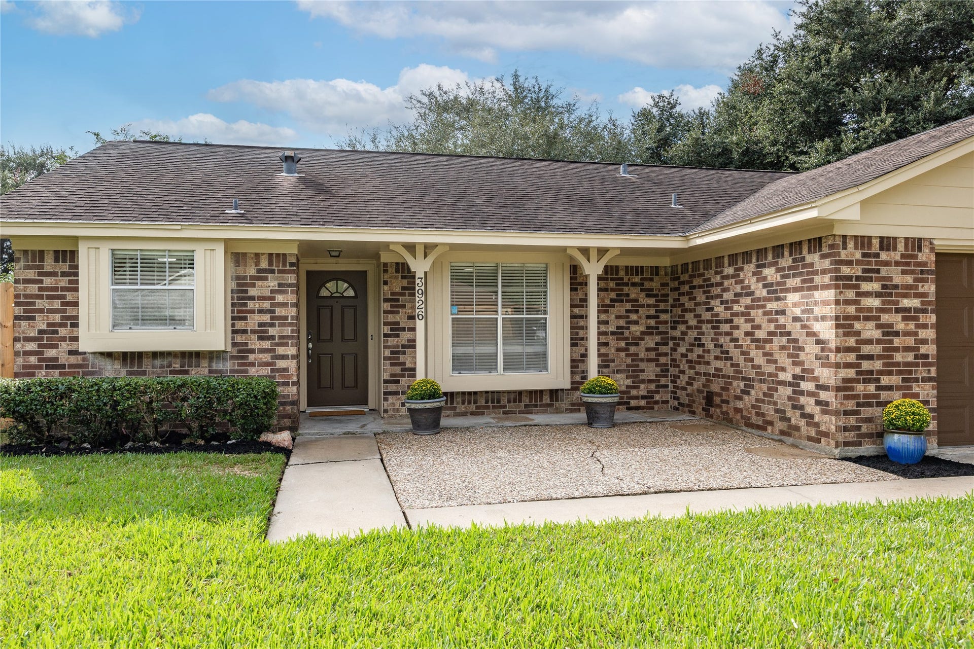 3926 Marilyn Street, Rosenberg, TX 77471 Quaint front patio with ample space for a small dining set and or Adirondack chairs