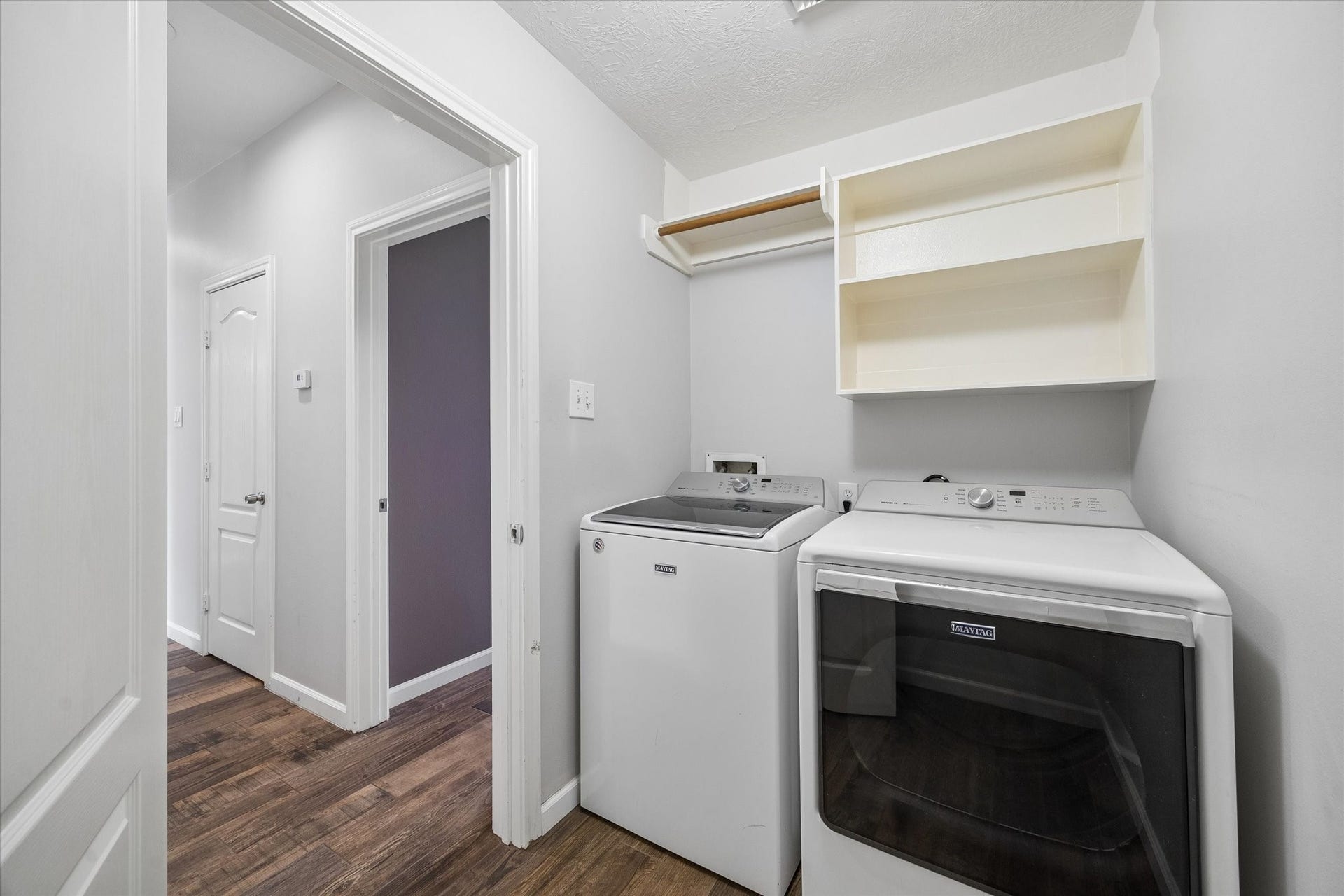 21519 Black Opal Lane, Kingwood, TX 77339 The laundry room has built-in storage and the MAYTAG washer and dryer are included with the house!