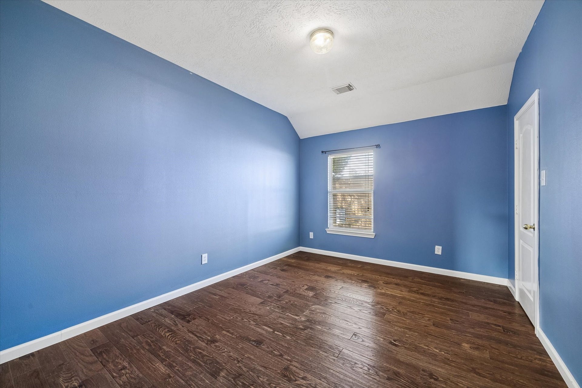21519 Black Opal Lane, Kingwood, TX 77339 This is the first of three upstairs bedrooms. All rooms are a good size. High ceilings and wood floors in all!