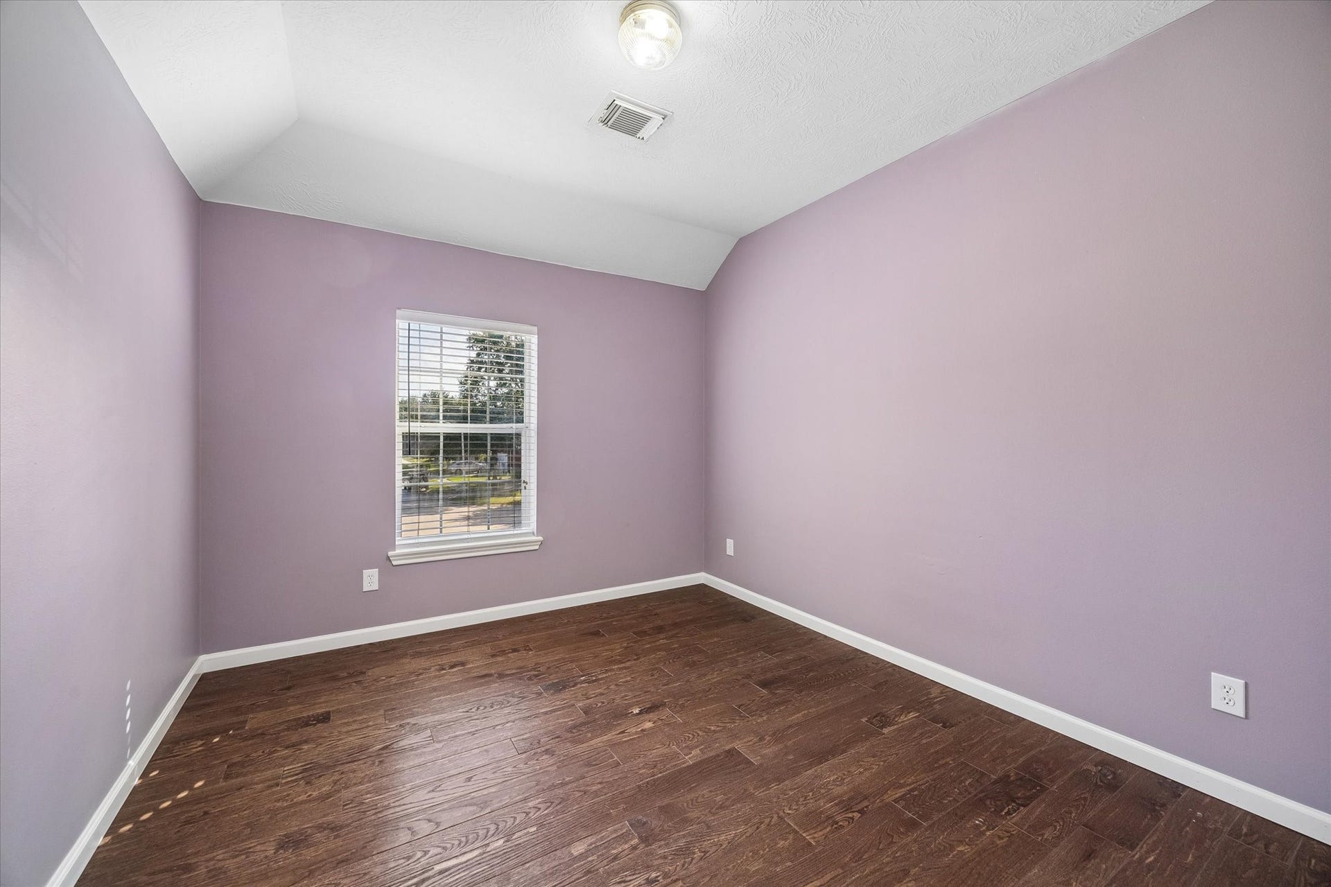 21519 Black Opal Lane, Kingwood, TX 77339 A cheery third guest bedroom upstairs overlooks the front yard.