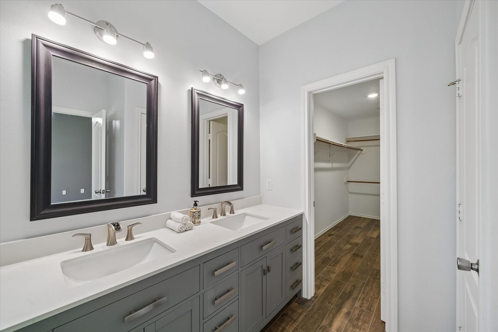 21519 Black Opal Lane, Kingwood, TX 77339 Additional updates in the bathroom inlcude double sinks, long vanity with tons of storage, waterfall faucets, framed mirrors, and lighting.