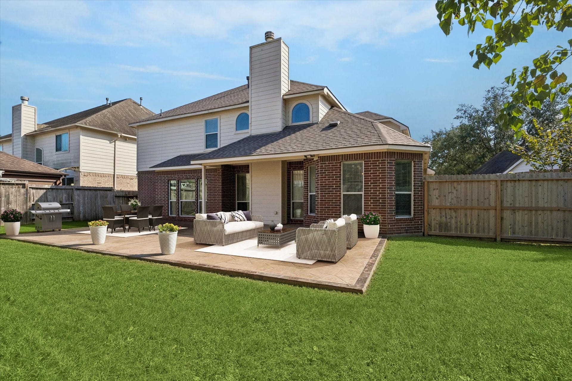 21519 Black Opal Lane, Kingwood, TX 77339 Virtually staged photo to show decorating possibilities - room for a dining set, outdoor living furniture, grill, and a fire pit!