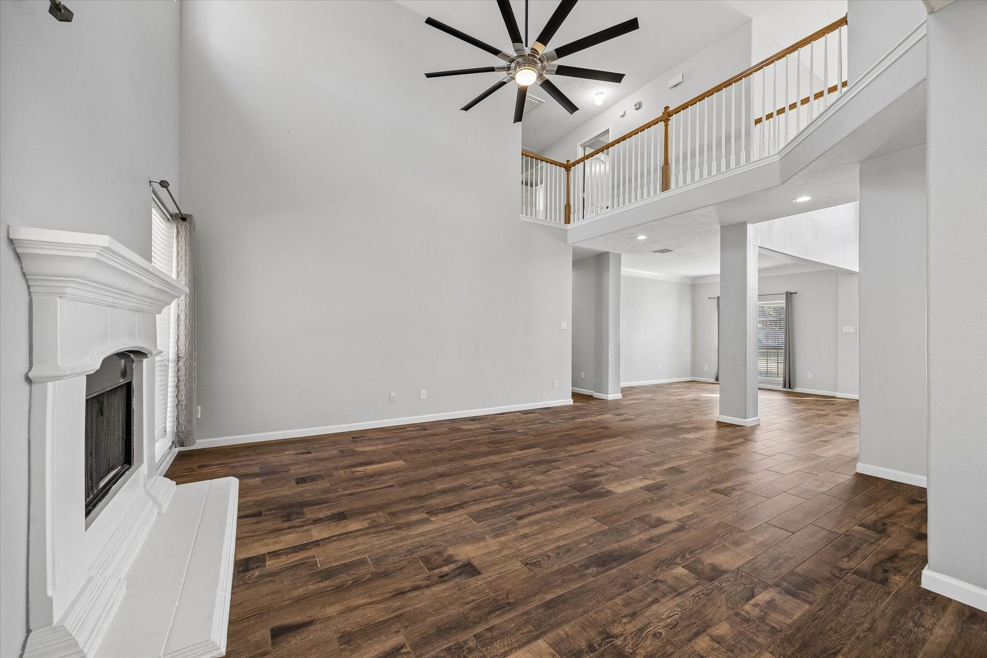 21519 Black Opal Lane, Kingwood, TX 77339 Beautiful wood-look tile runs throughout the open spaces. A modernized ceiling fan keeps everyone cool!