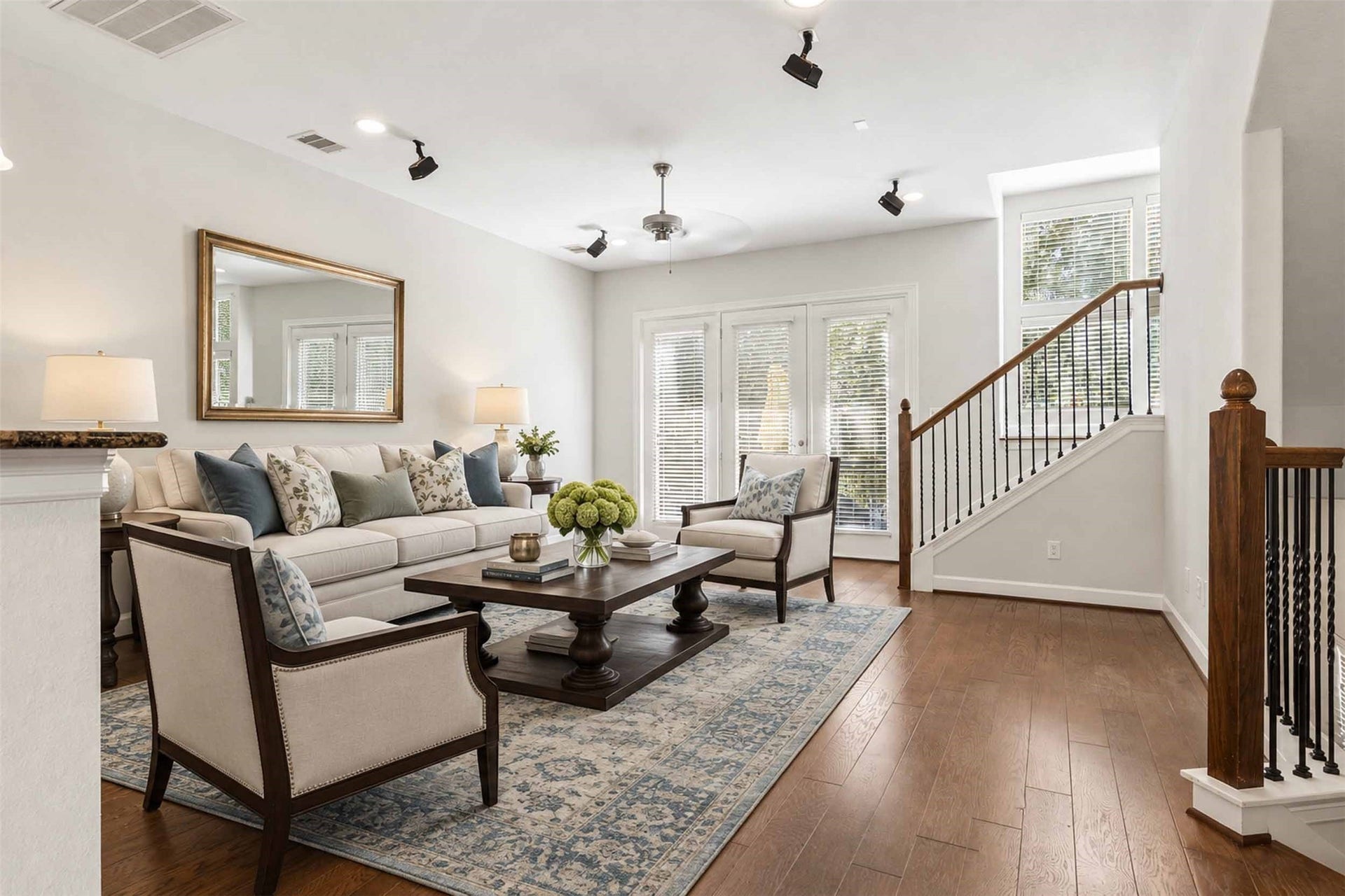 2811 Clay Street, Houston, TX 77003 Staged large living room with surround sound and balcony looking over quiet treed view.