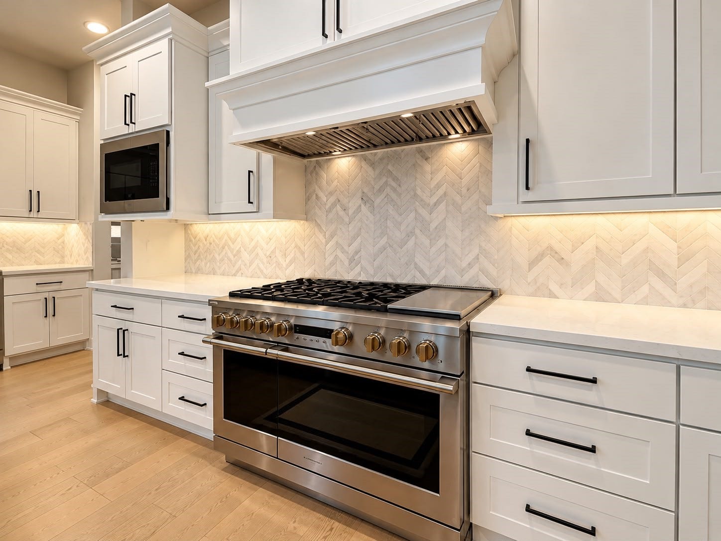 413 Forest Reserve Place, Houston, TX 77079 Modern gourmet kitchen featuring white shaker cabinets, stainless steel professional-style gas range, custom range hood, herringbone tile backsplash, and elegant countertops.