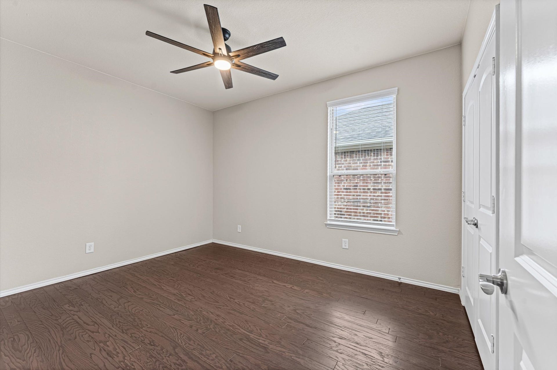 317 Fell Lane, Spring, TX 77382 A nicely sized secondary bedroom flooded with multi-directional natural light, complete with an expansive reach-in wardrobe closet.