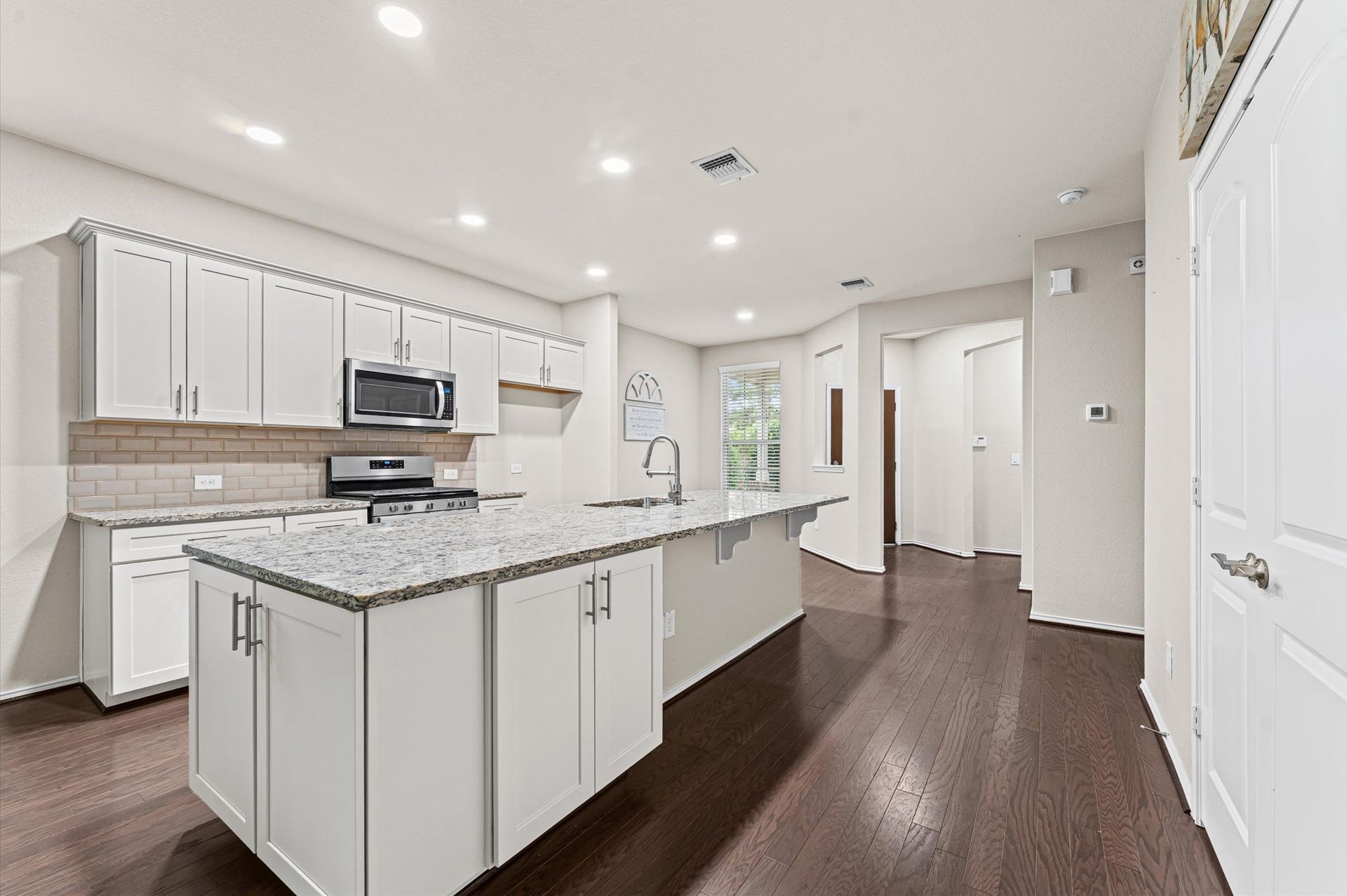 317 Fell Lane, Spring, TX 77382 The stunning kitchen offers seamless storage and a sophisticated, organizing aesthetics.