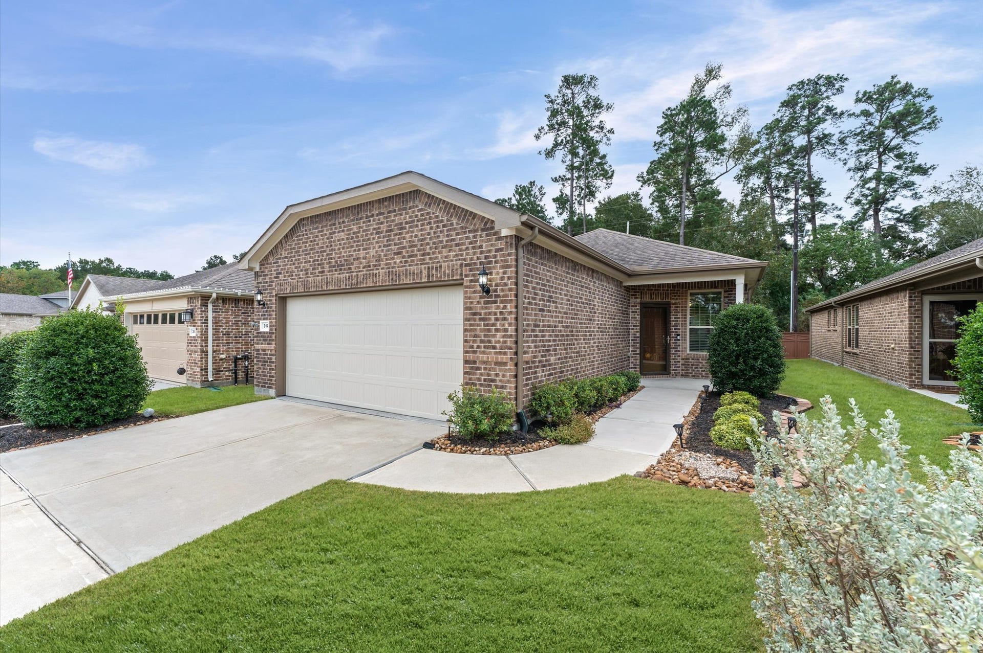 317 Fell Lane, Spring, TX 77382 An optimized two-car garage with ample storage space completes this exceptional home, providing a highly organized, seamless transition from the vehicle to the living quarters while keeping utility tools and bulk items completely hidden.