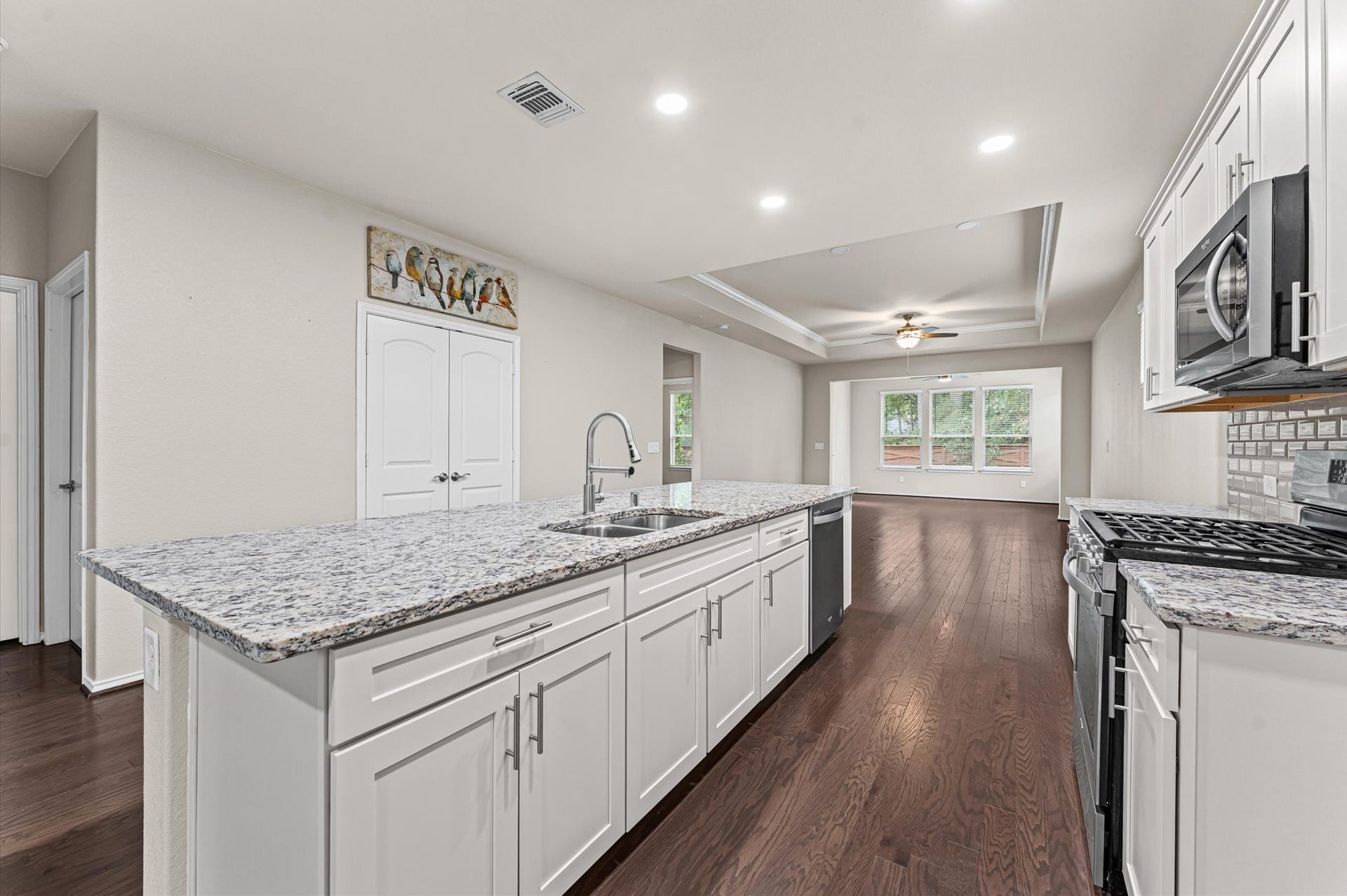 317 Fell Lane, Spring, TX 77382 The under-mount stainless steel sink comes equipped with a dedicated, high-end water filtration system spigot, offering instant access to crisp, pure drinking water directly from the counter.