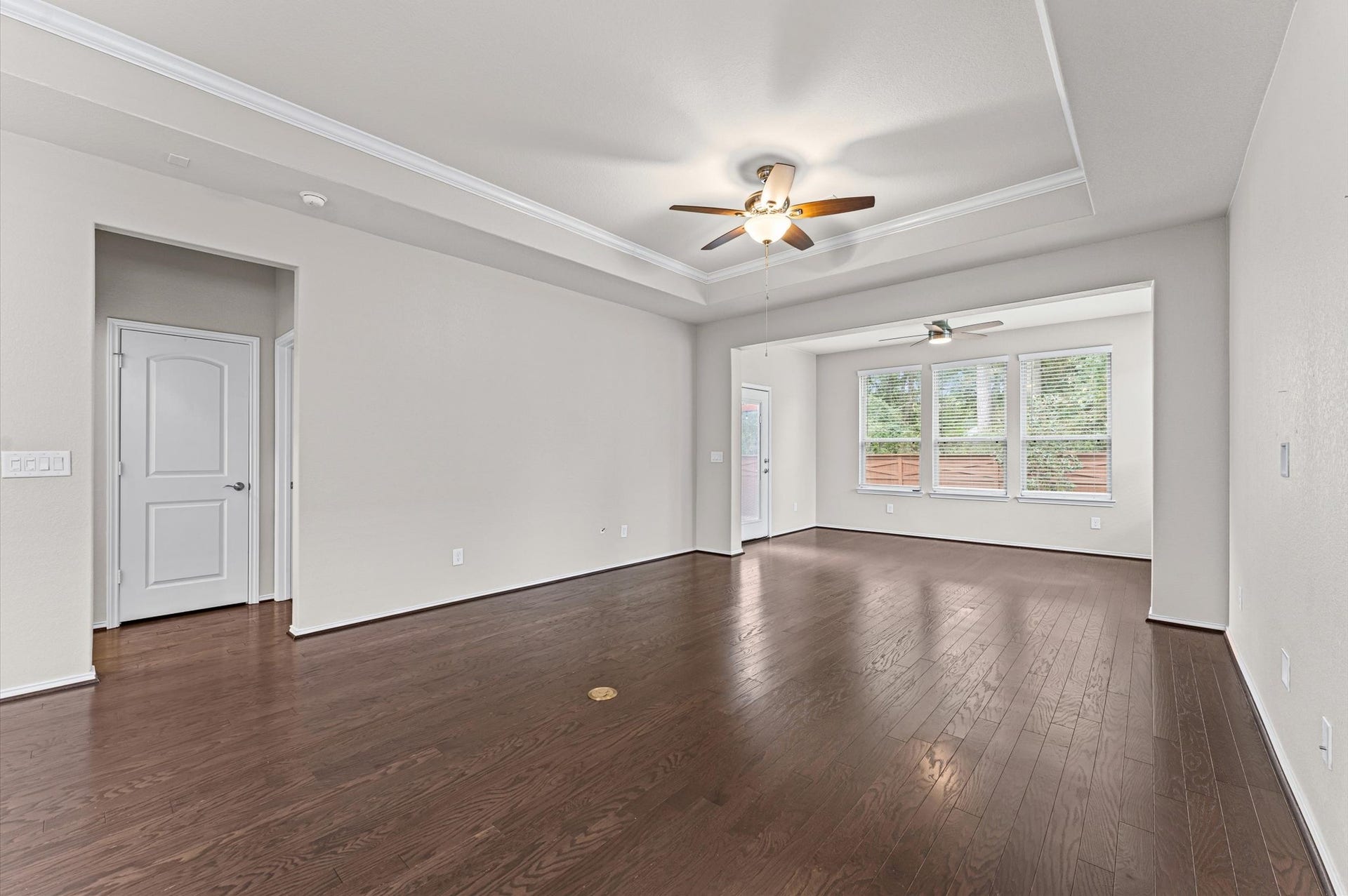 317 Fell Lane, Spring, TX 77382 Blessed with a continuous wash of bright, daytime sunshine, the living room's open-concept design flows unimpeded into the adjacent kitchen and sunroom, ensuring you never miss a moment of conversation with guests.