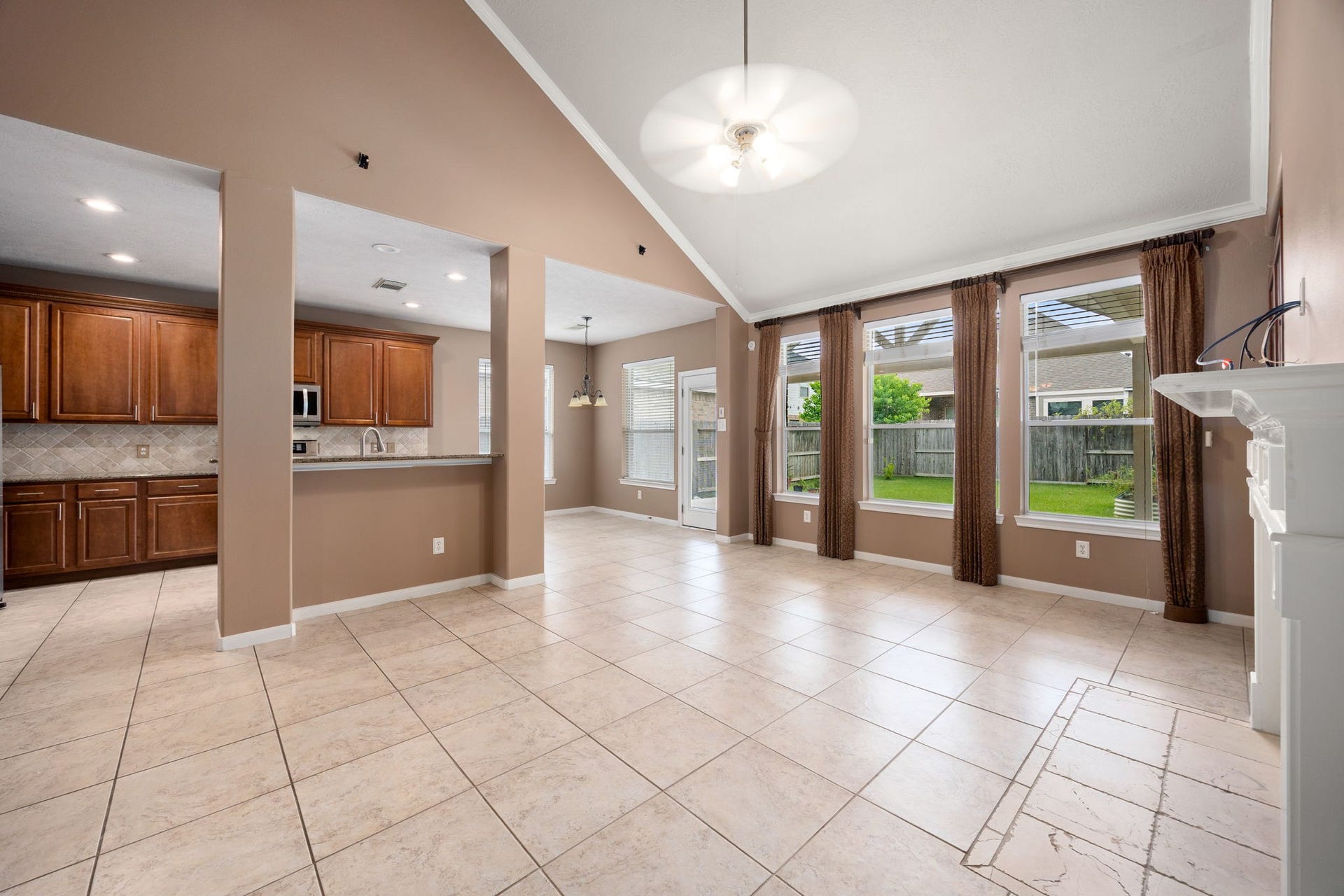 Designed for effortless hosting, this open floor plan perfectly connects the main living room to the kitchen and dining areas. The kitchen features an extended breakfast bar overlooking the family room, keeping the chef connected to the conversation and the beautiful backyard views.