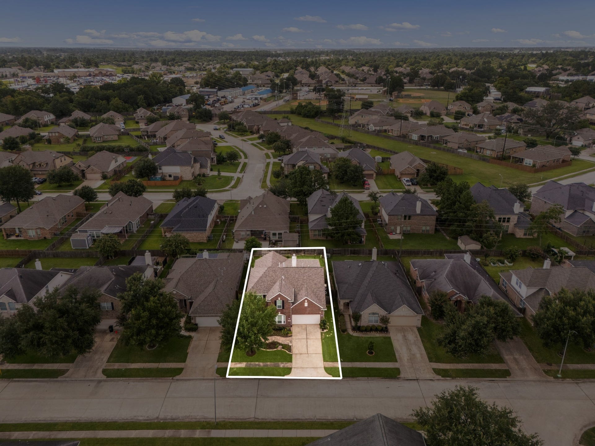 Additional aerial view of the home's location in County Lakes Estates.